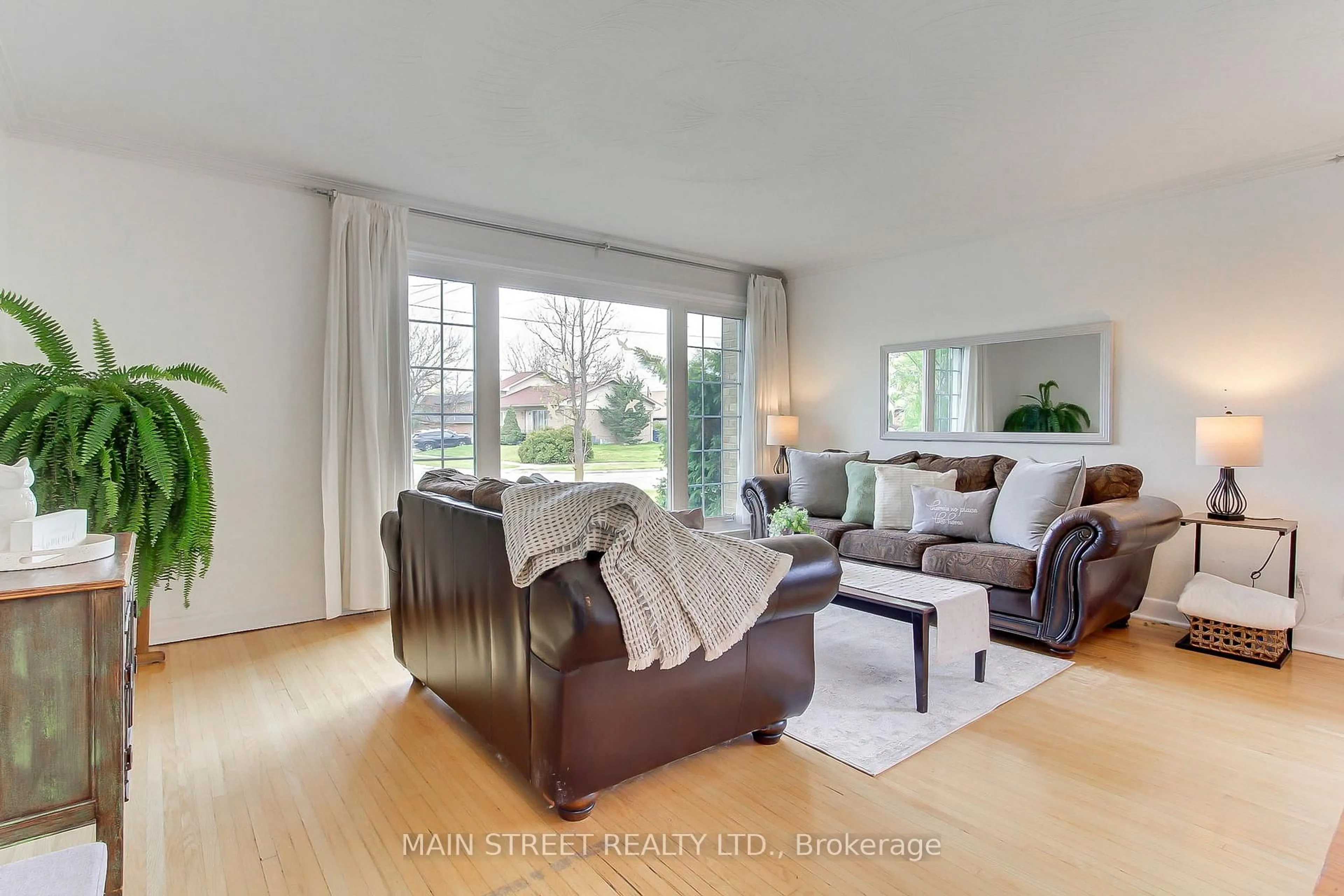 Living room with furniture, wood/laminate floor for 14 Westhampton Dr, Toronto Ontario M9R 1X6