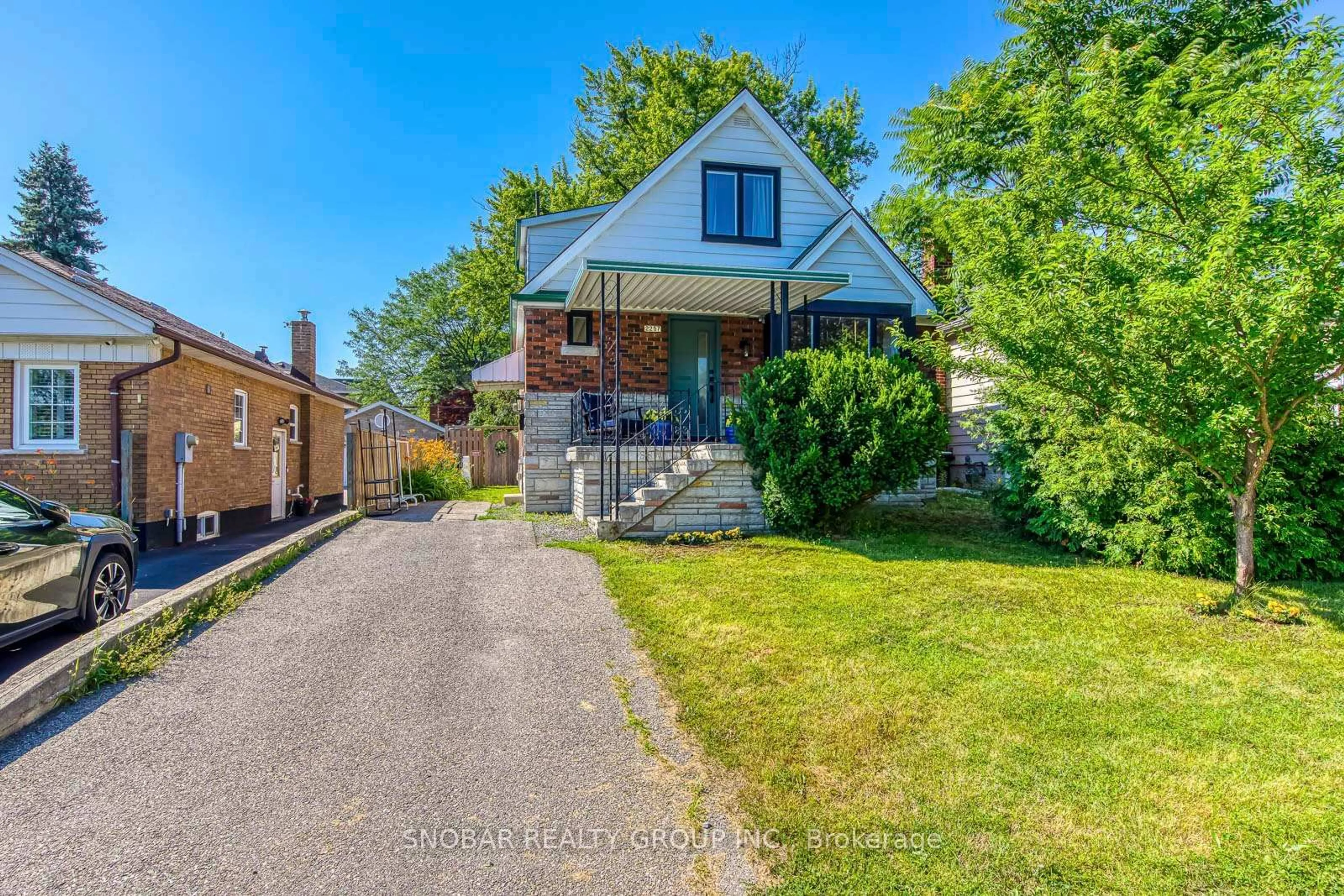 Home with brick exterior material, street for 2257 Lawrence Ave, Toronto Ontario M9P 2A4