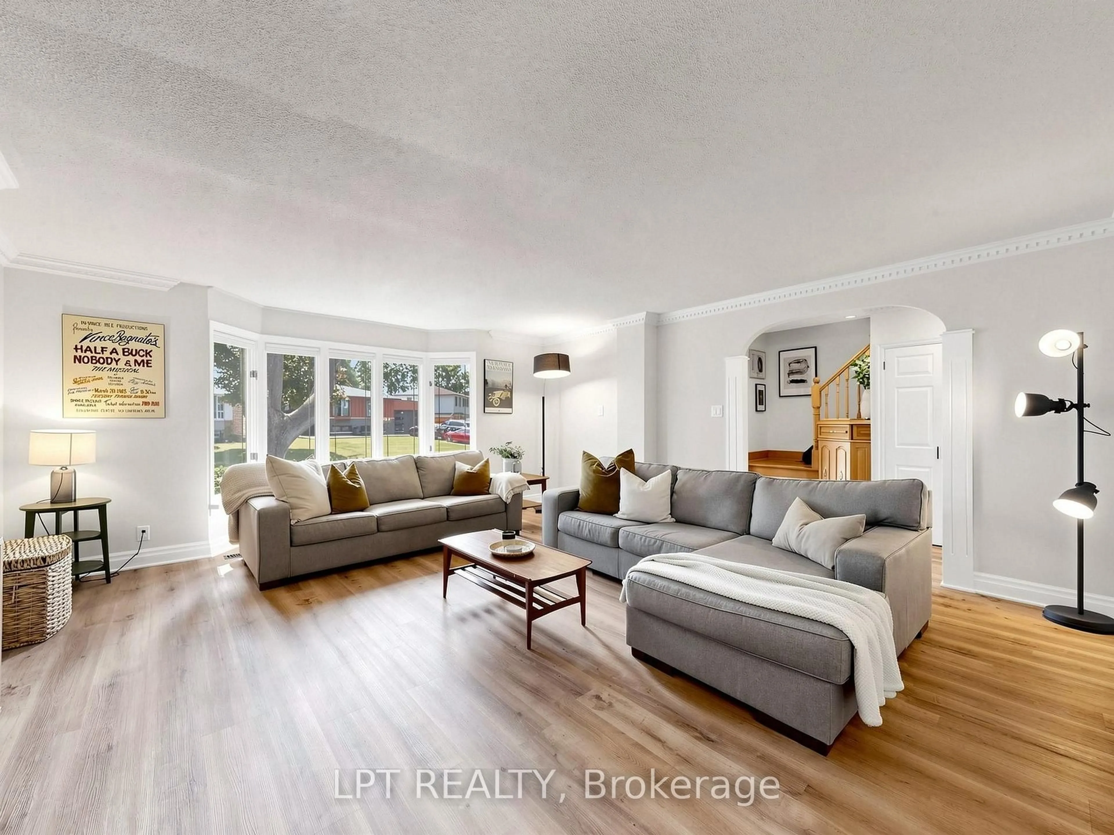 Living room with furniture, wood/laminate floor for 70 Roberts Cres, Brampton Ontario L6W 1G8