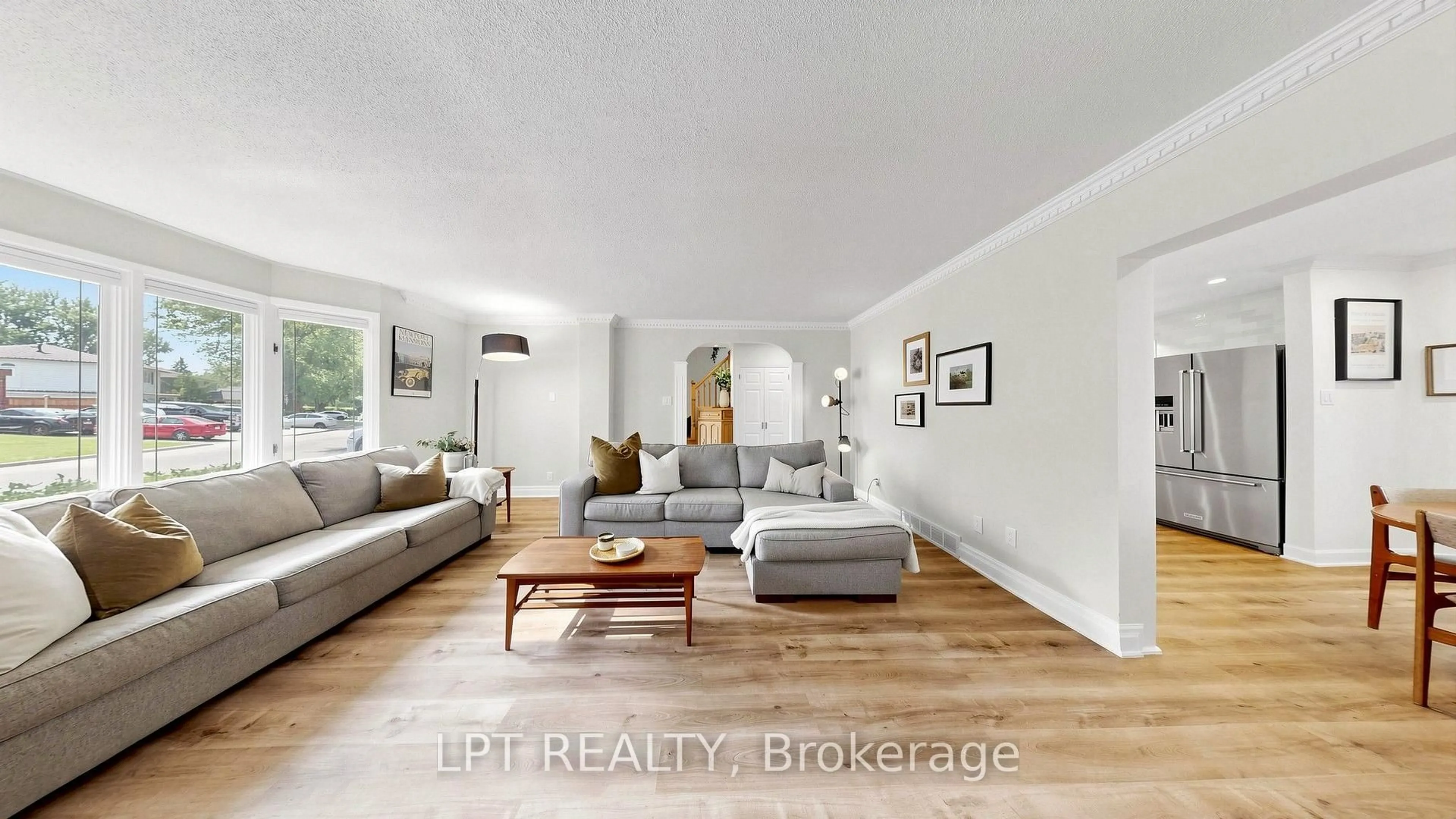 Living room with furniture, wood/laminate floor for 70 Roberts Cres, Brampton Ontario L6W 1G8