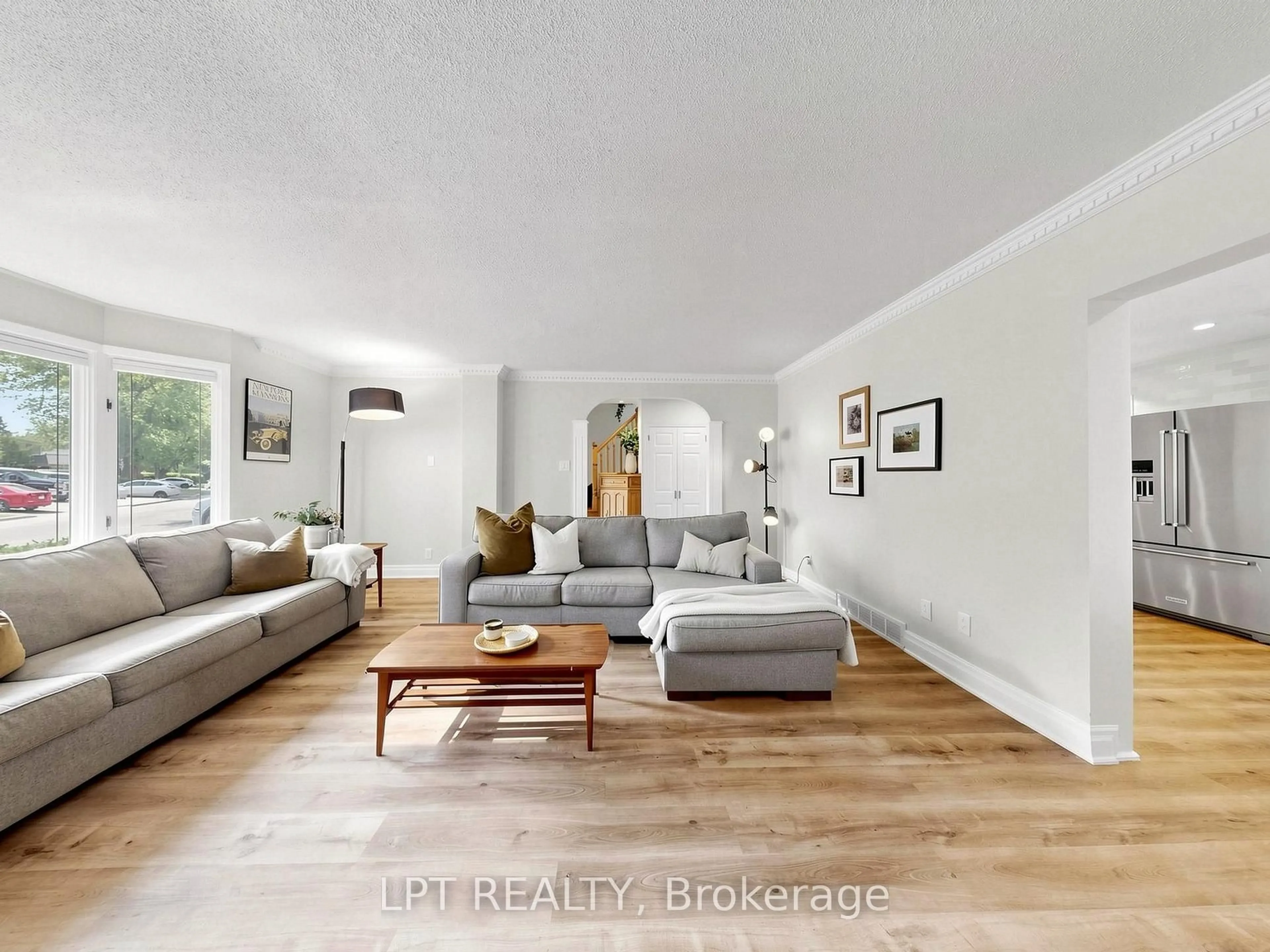 Living room with furniture, wood/laminate floor for 70 Roberts Cres, Brampton Ontario L6W 1G8