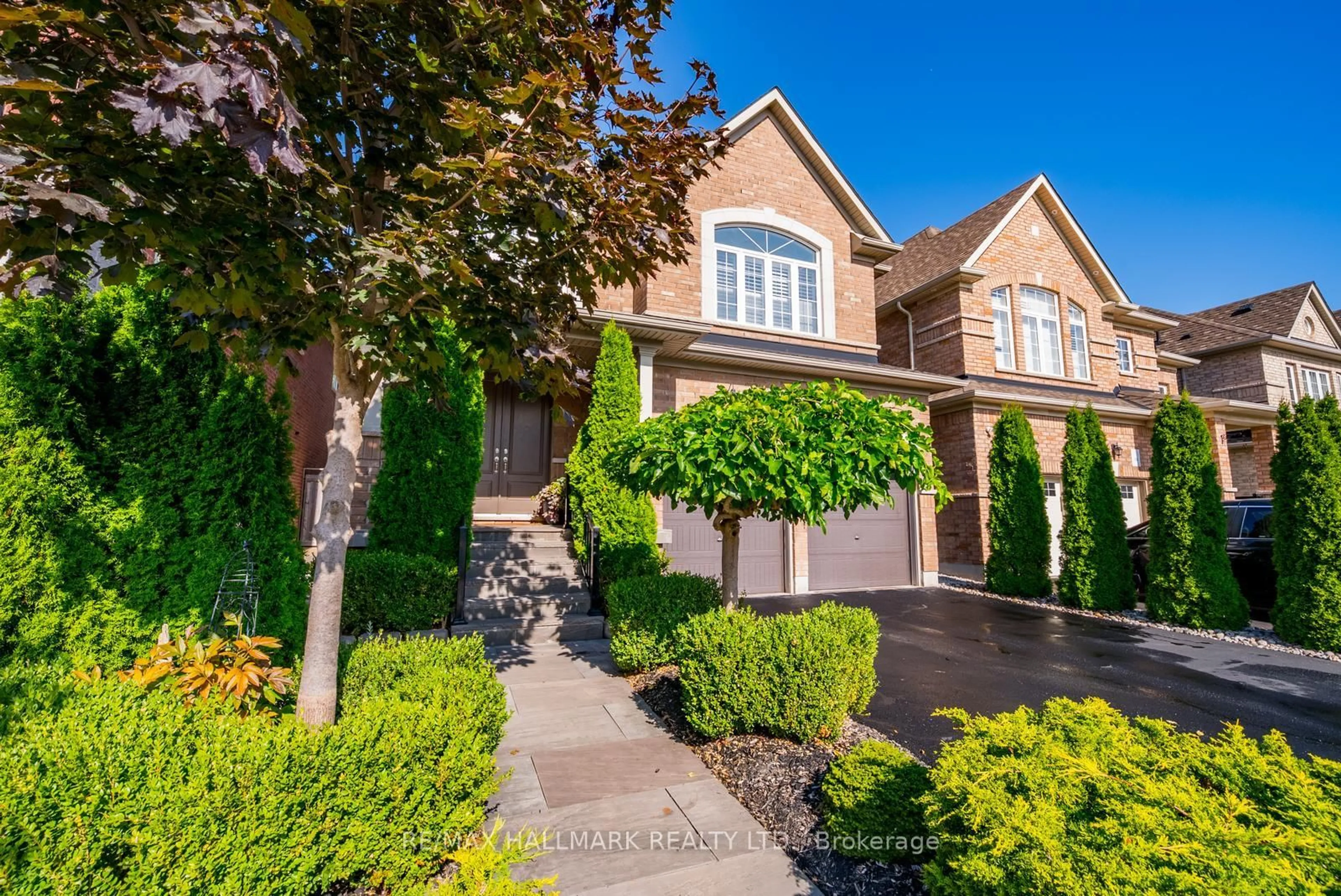 Home with brick exterior material, street for 124 Bonnie Braes Dr, Brampton Ontario L6Y 0W7