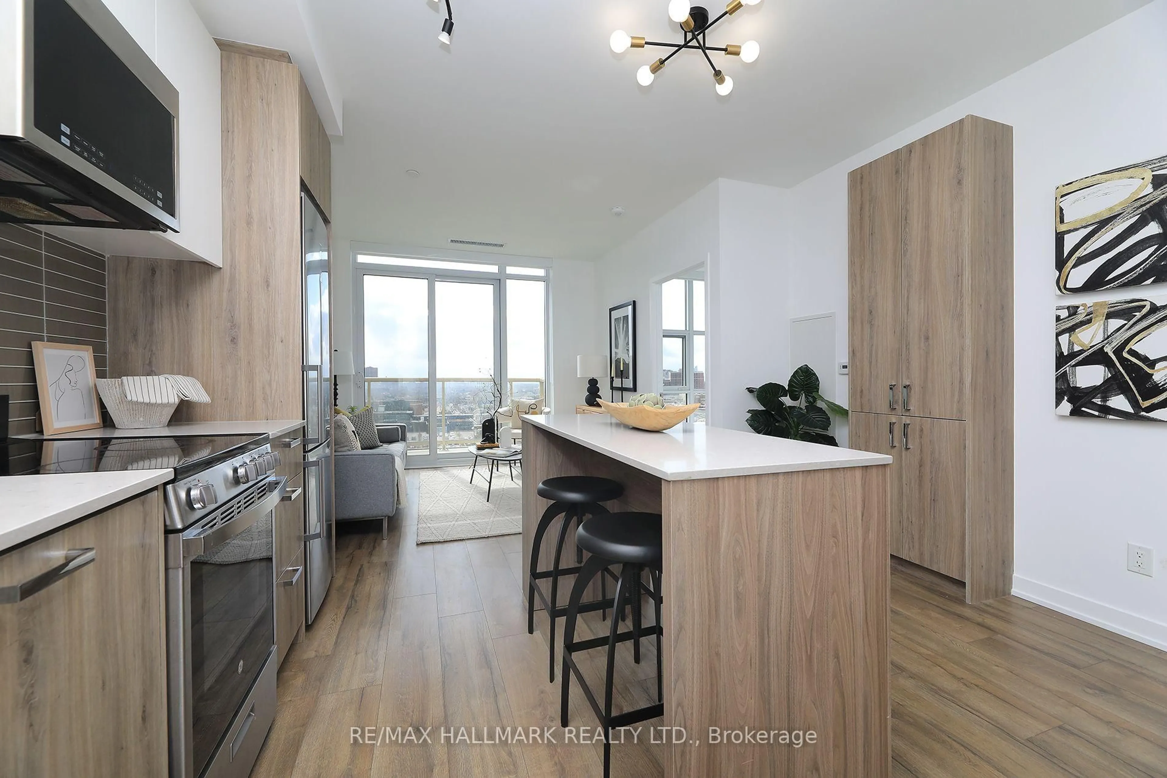 Open concept kitchen, wood/laminate floor for 1787 St. Clair Ave #1111, Toronto Ontario M6N 0B7