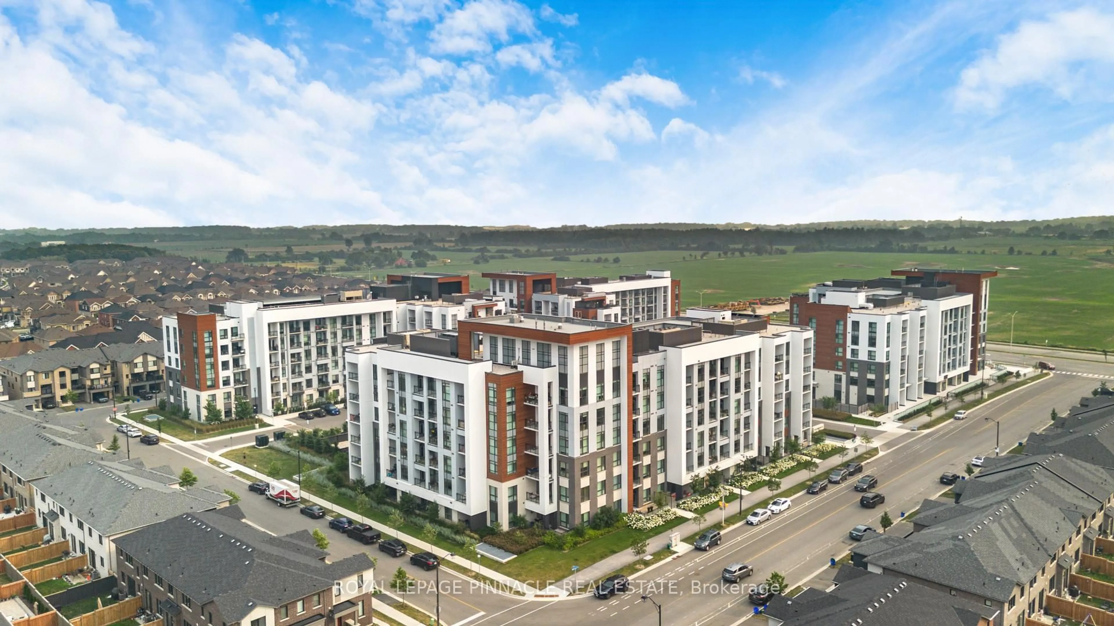 A pic from outside/outdoor area/front of a property/back of a property/a pic from drone, city buildings view from balcony for 460 Gordon Krantz Ave #209, Milton Ontario L9E 1Z2