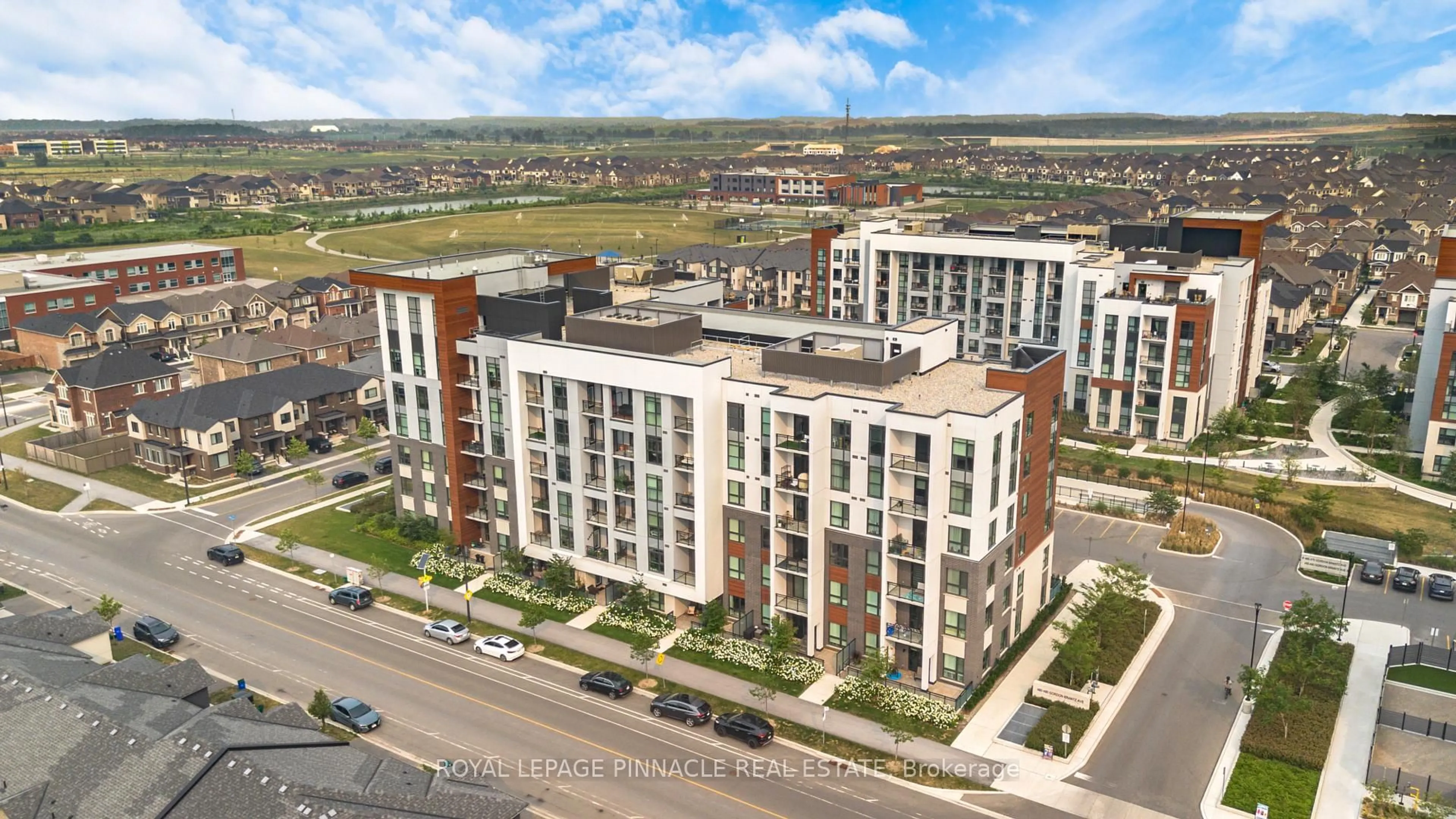 A pic from outside/outdoor area/front of a property/back of a property/a pic from drone, city buildings view from balcony for 460 Gordon Krantz Ave #209, Milton Ontario L9E 1Z2