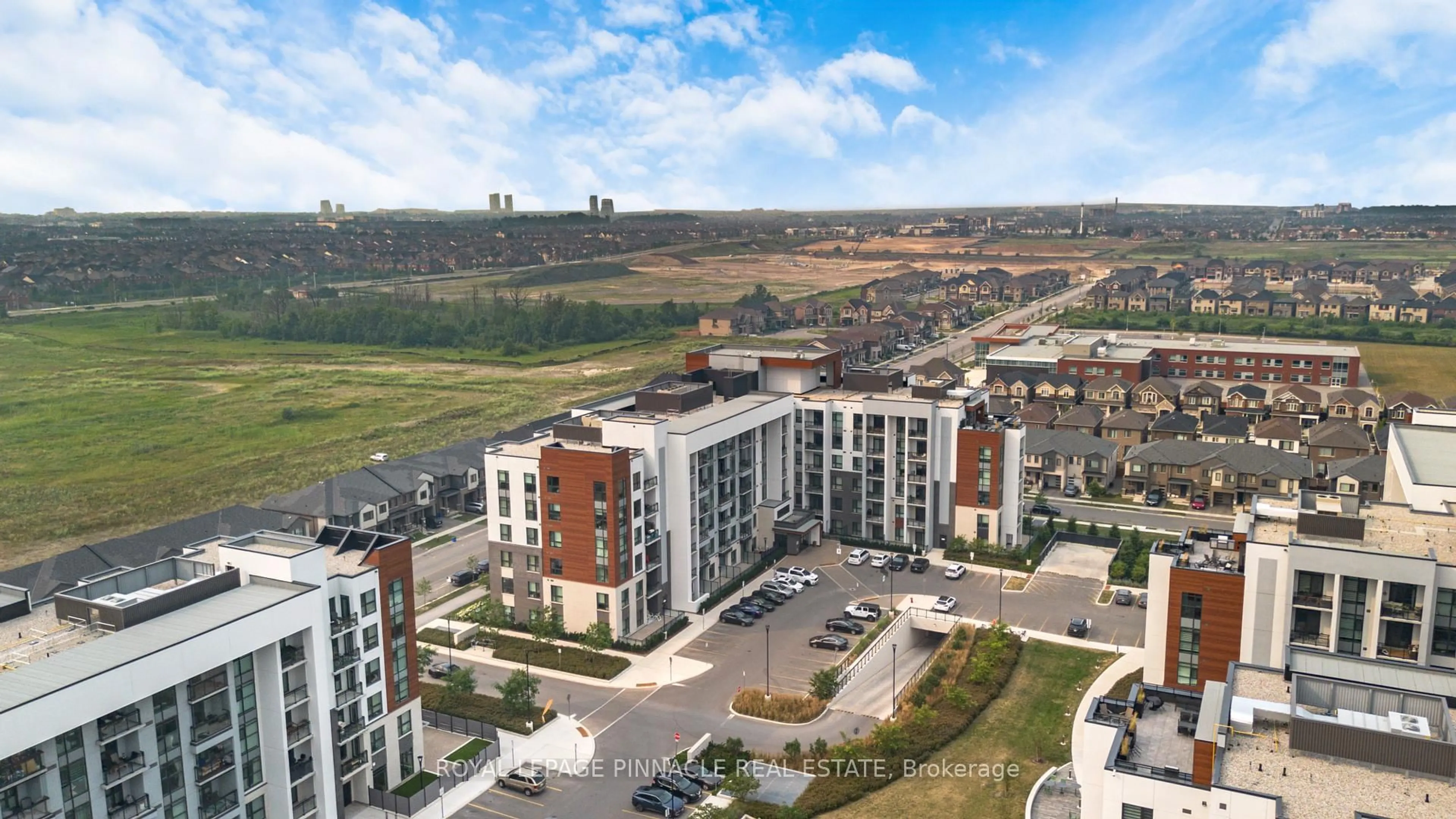 A pic from outside/outdoor area/front of a property/back of a property/a pic from drone, city buildings view from balcony for 460 Gordon Krantz Ave #209, Milton Ontario L9E 1Z2