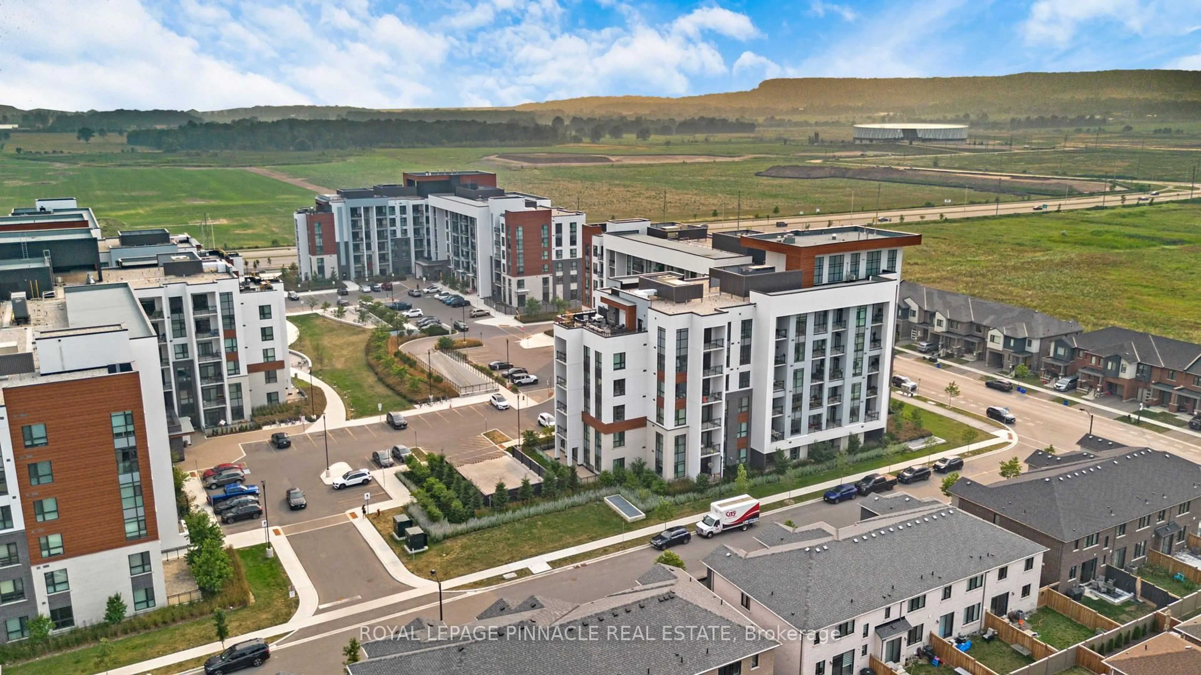 A pic from outside/outdoor area/front of a property/back of a property/a pic from drone, unknown for 460 Gordon Krantz Ave #209, Milton Ontario L9E 1Z2