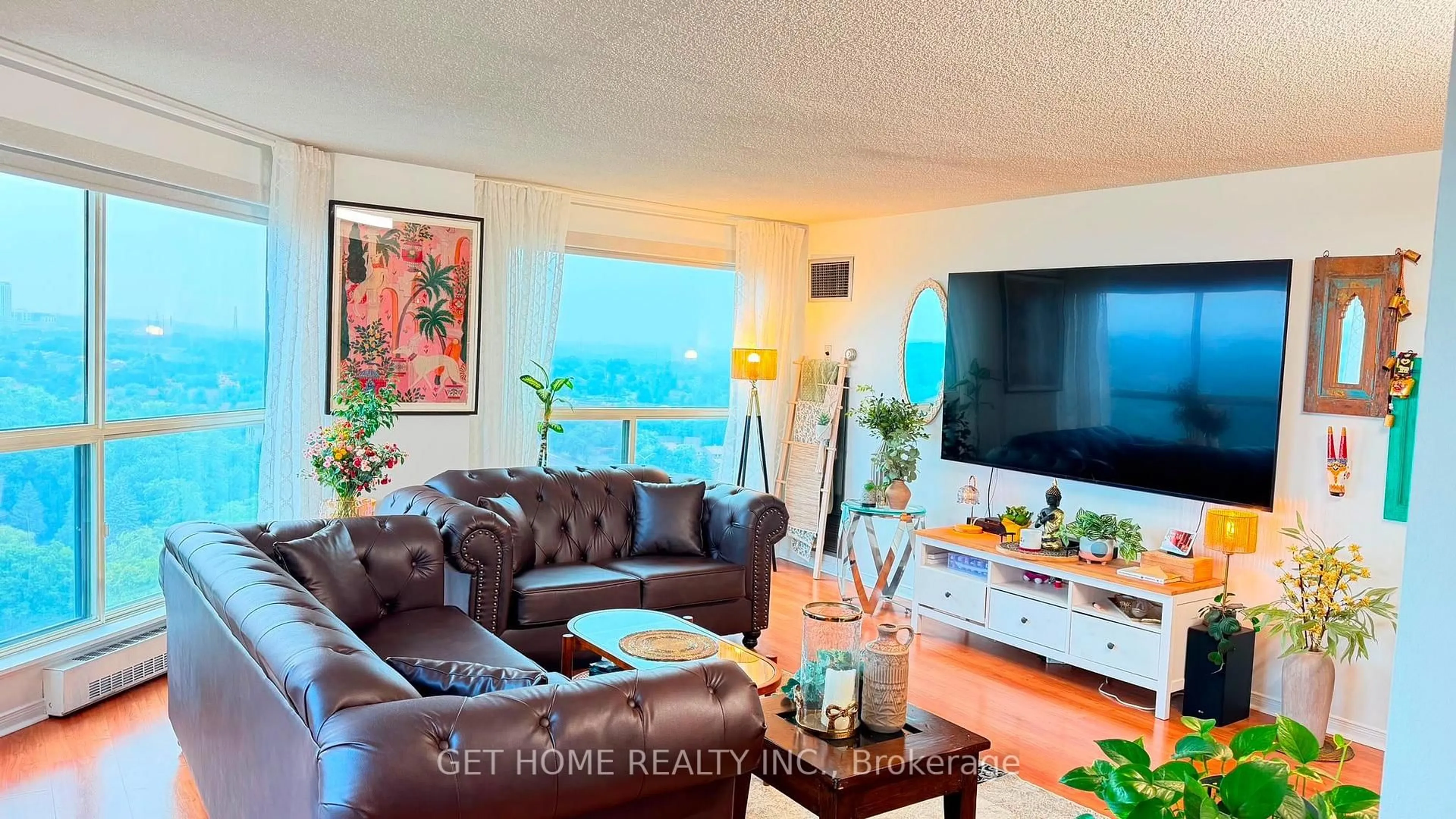 Living room with furniture, wood/laminate floor for 2155 Burnhamthorpe Rd #1709, Mississauga Ontario L5L 5P4