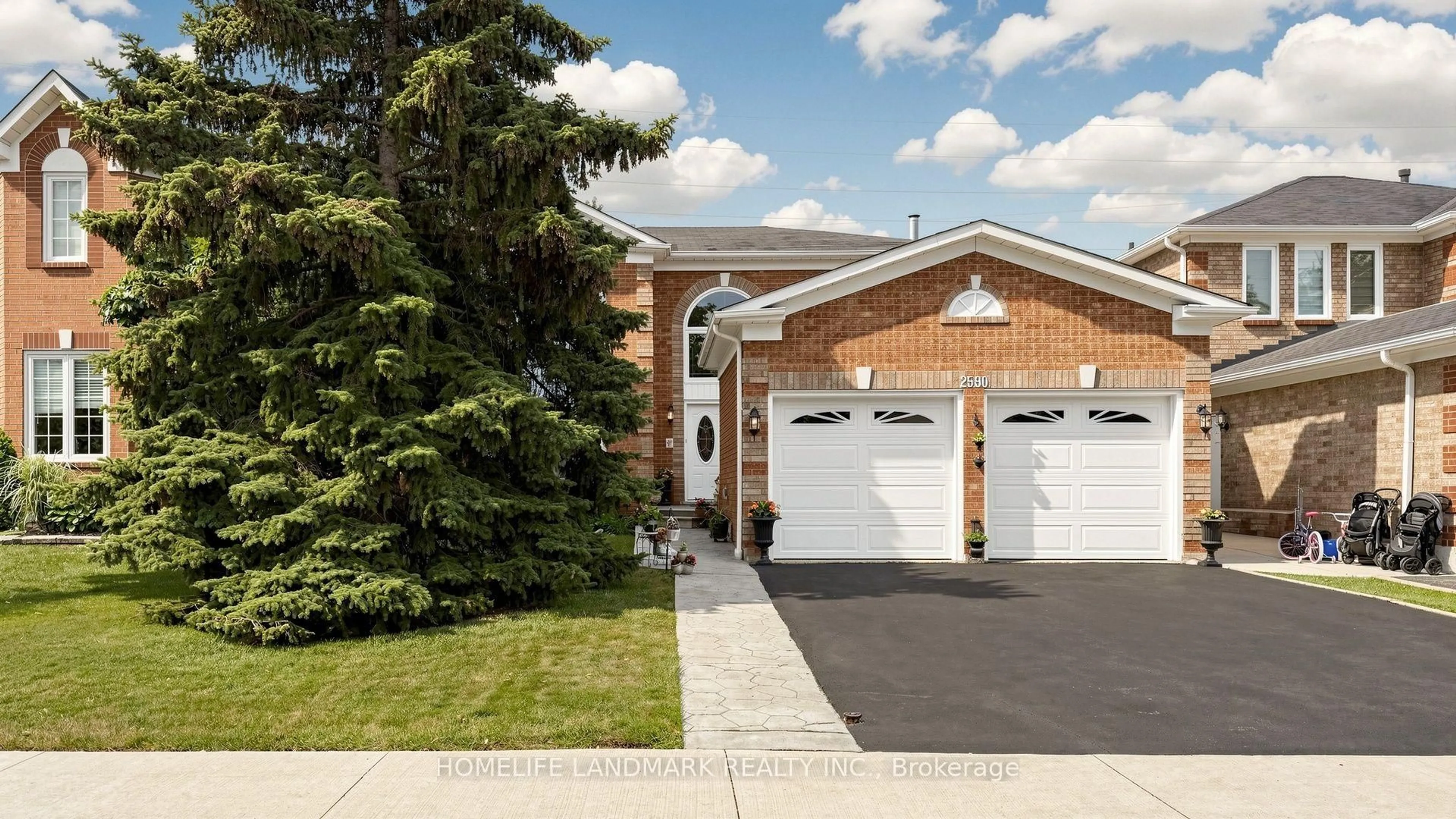 Home with brick exterior material, street for 2590 Ambercroft Tr, Mississauga Ontario L5M 4K3