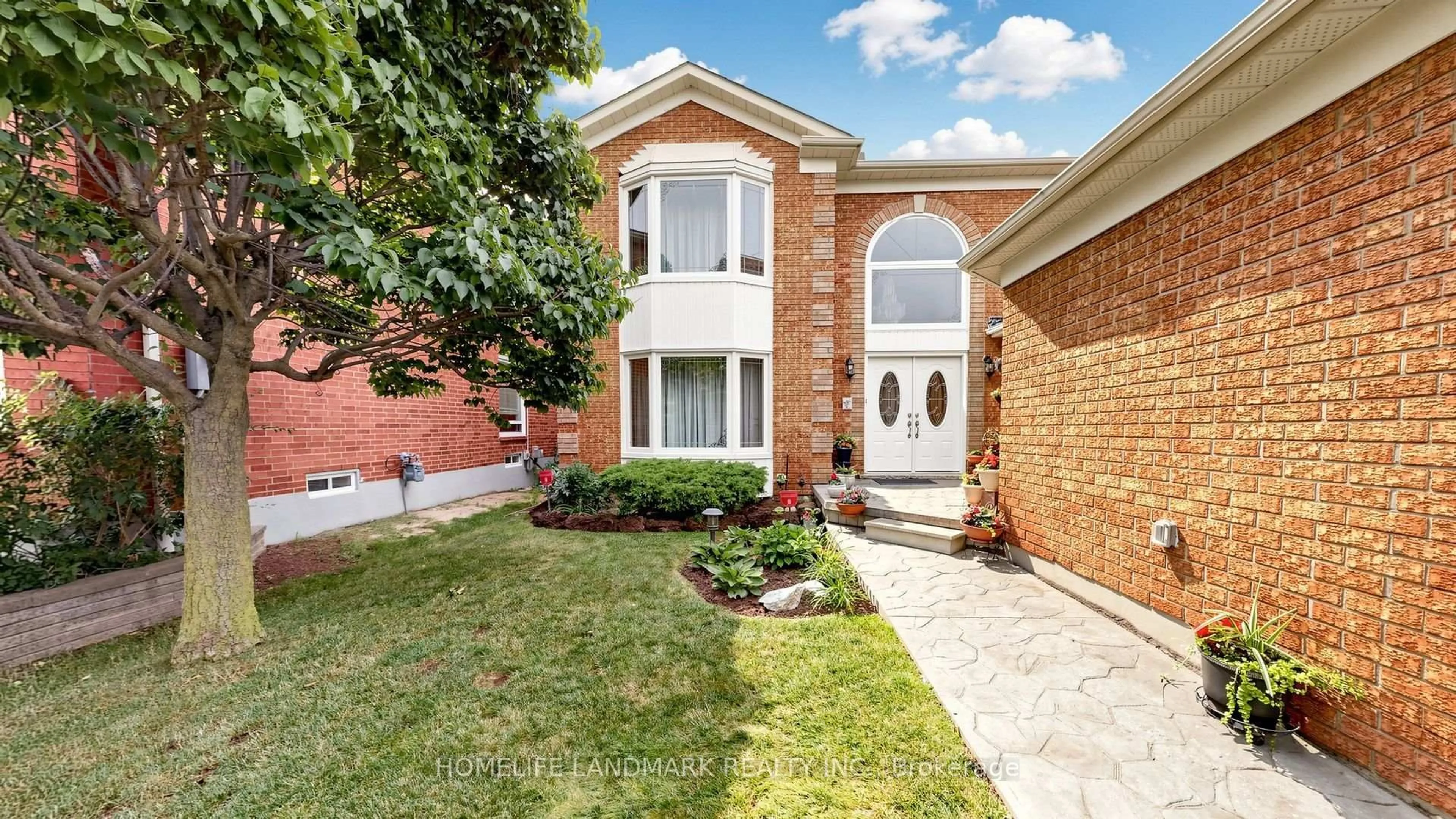 Home with brick exterior material, street for 2590 Ambercroft Tr, Mississauga Ontario L5M 4K3