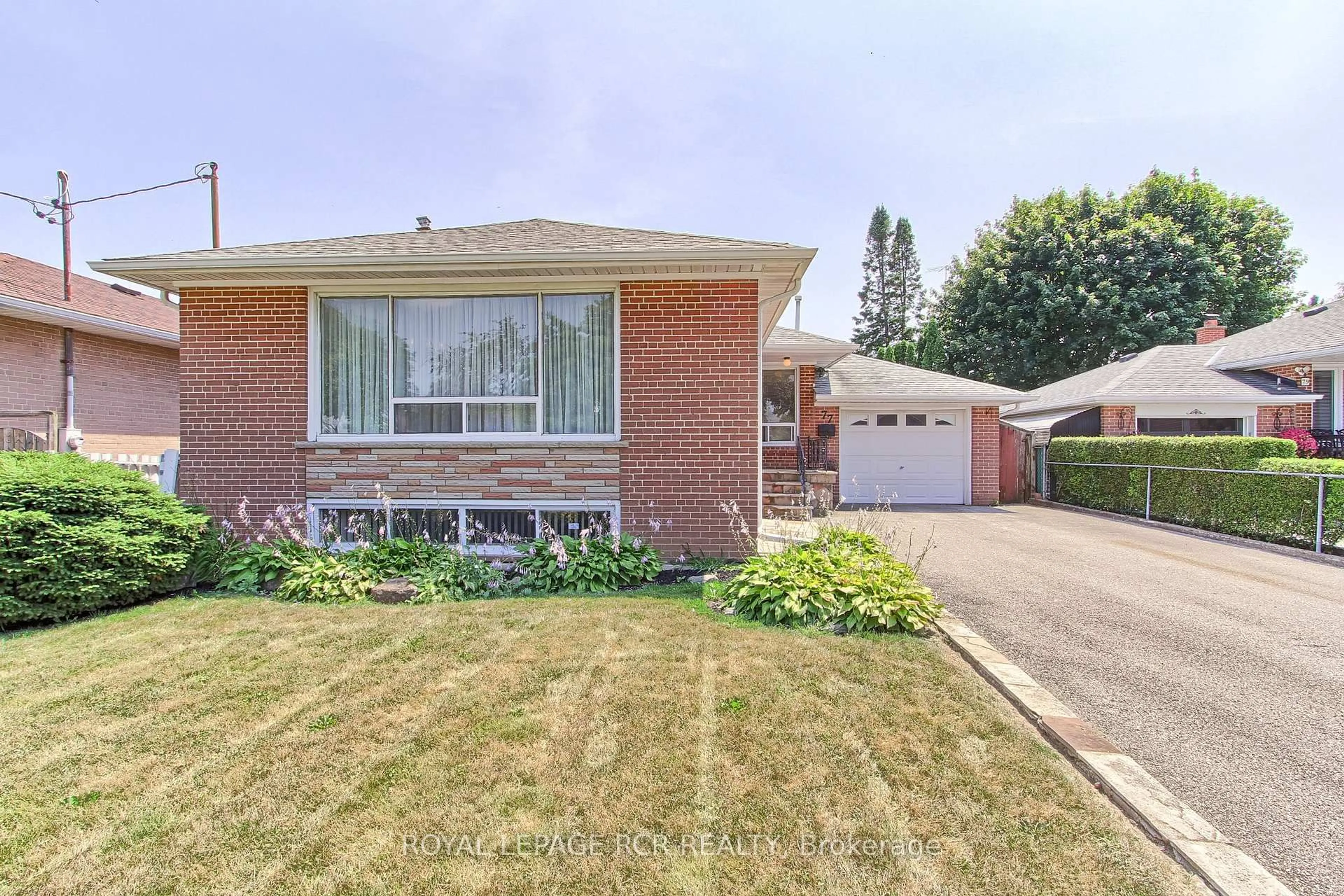Home with brick exterior material, street for 77 Alhart Dr, Toronto Ontario M9V 2N1