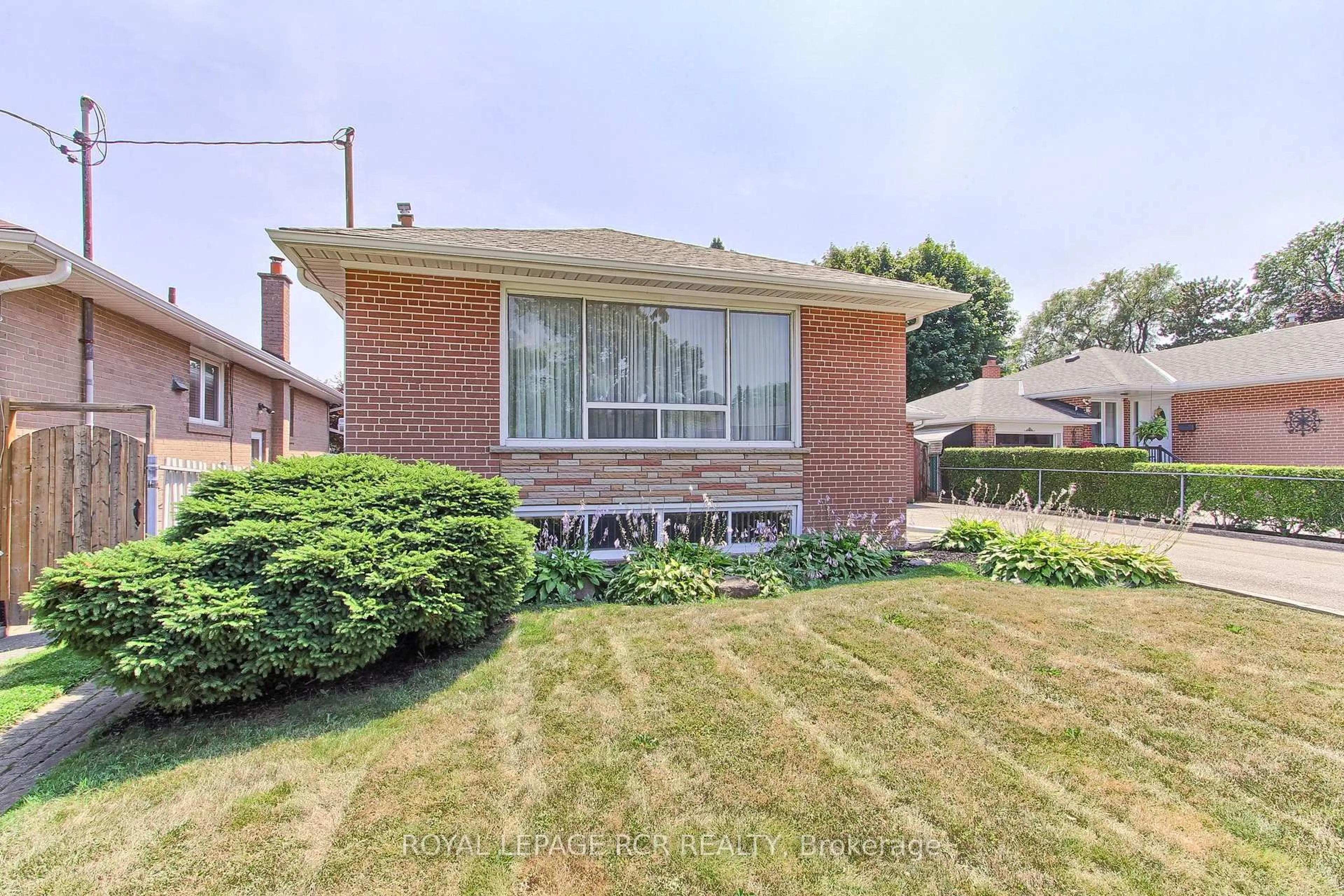 Home with brick exterior material, street for 77 Alhart Dr, Toronto Ontario M9V 2N1