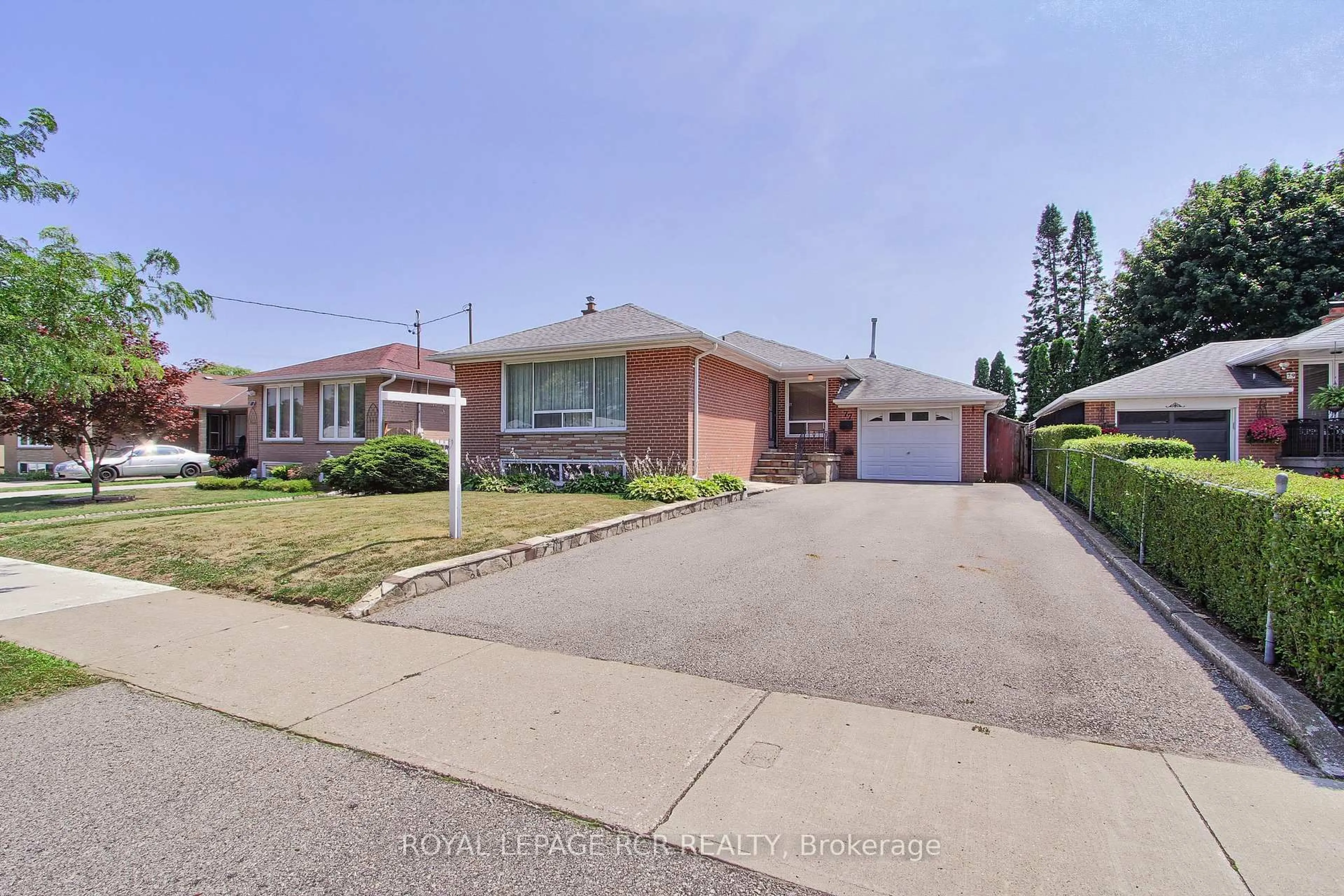 Home with brick exterior material, street for 77 Alhart Dr, Toronto Ontario M9V 2N1