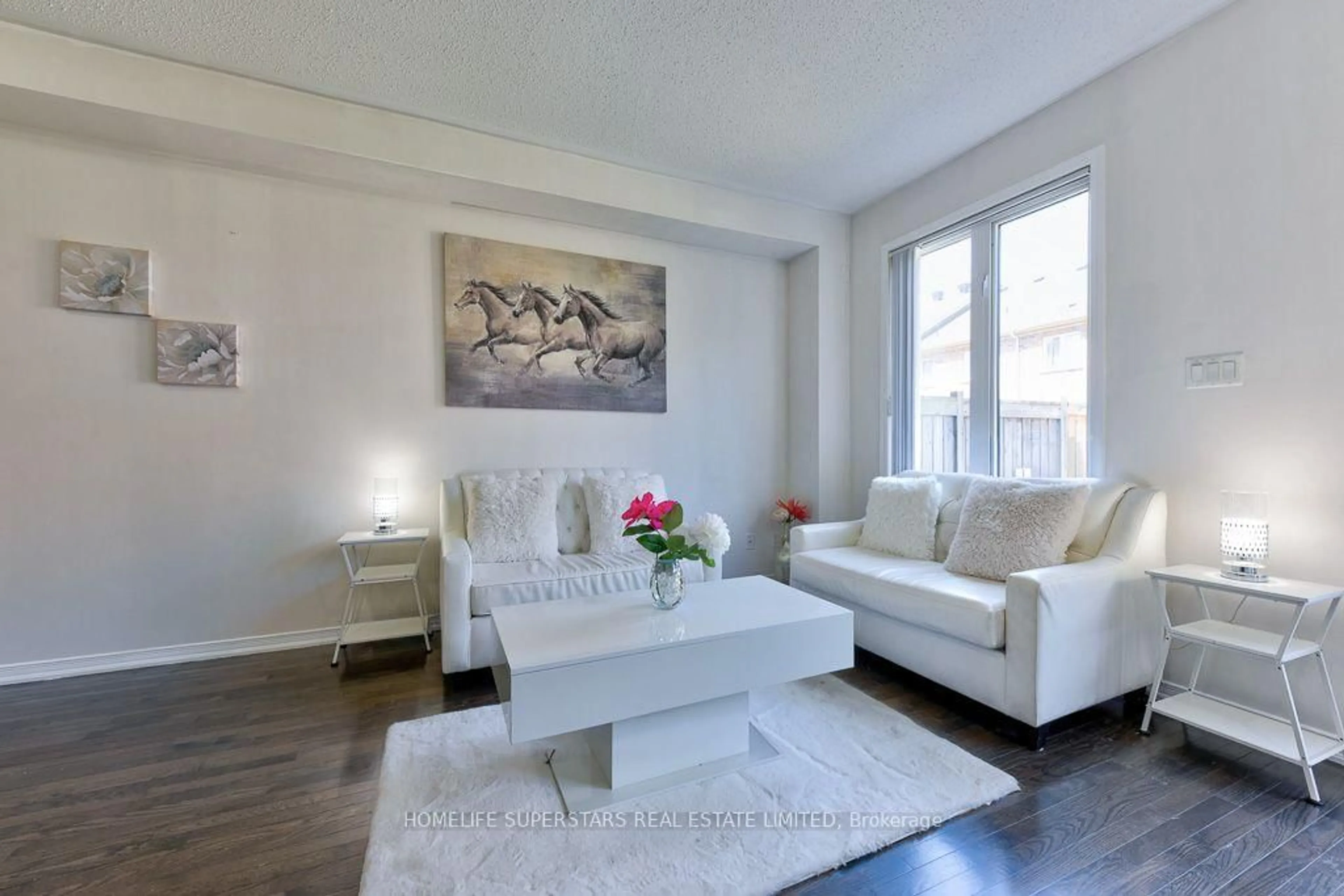 Living room with furniture, wood/laminate floor for 61 Utopia Way, Brampton Ontario L6P 4A4