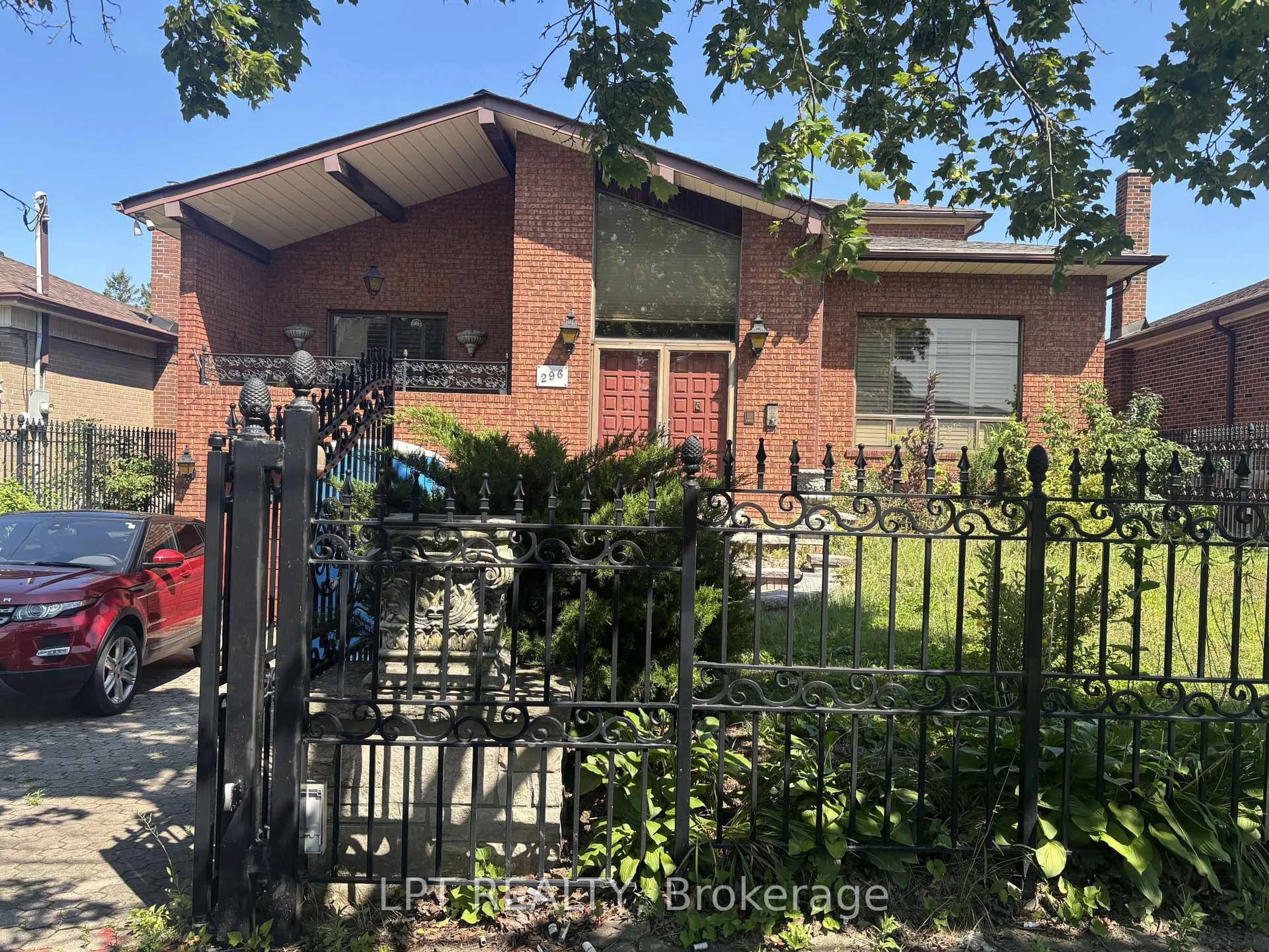 Home with brick exterior material, street for 296 Rustic Rd, Toronto Ontario M6L 1W4