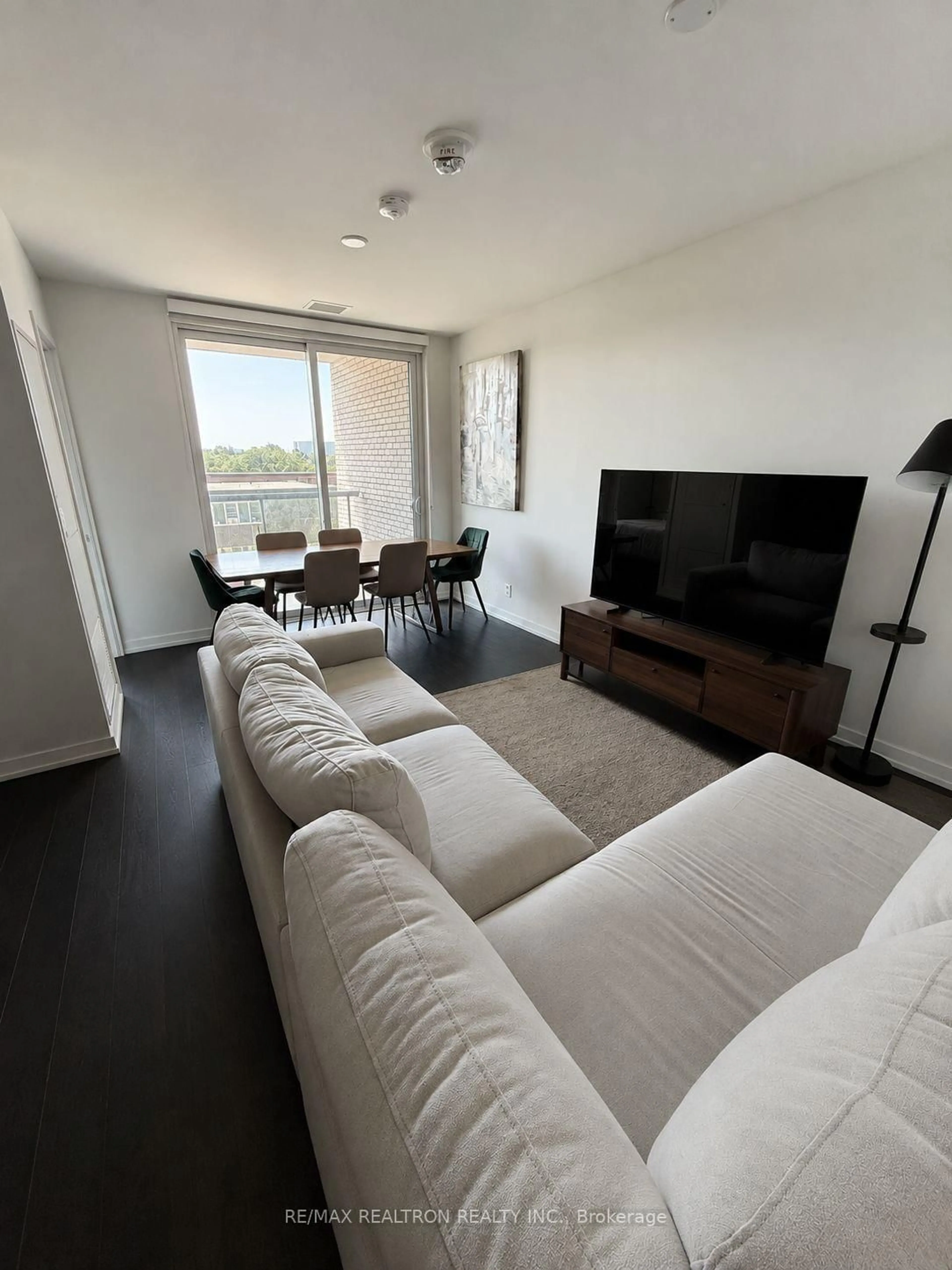 Living room with furniture, wood/laminate floor for 3100 Keele St #430, Toronto Ontario M3M 0E1