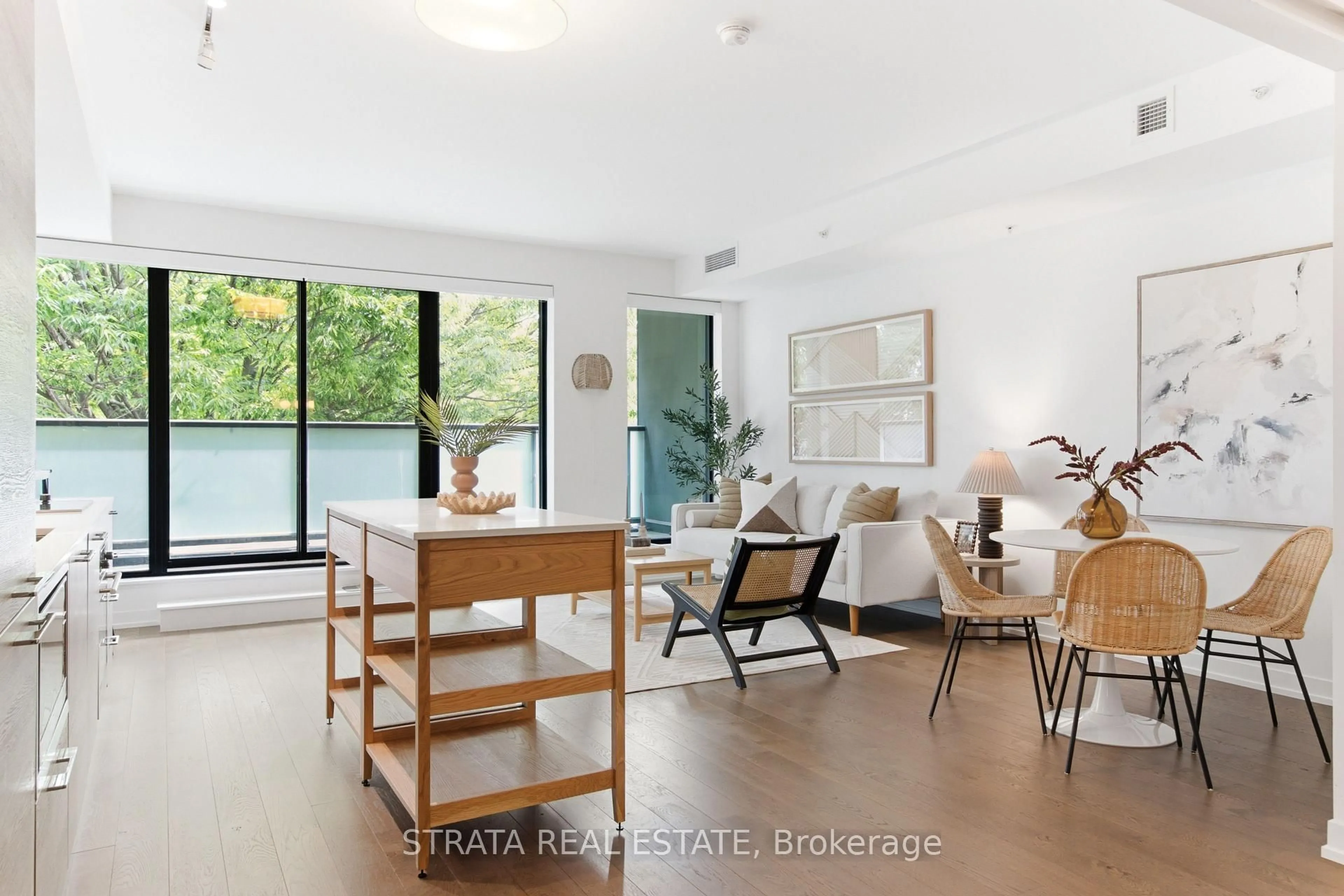 Living room with furniture, wood/laminate floor for 530 Indian Grve #302, Toronto Ontario M6P 0B3