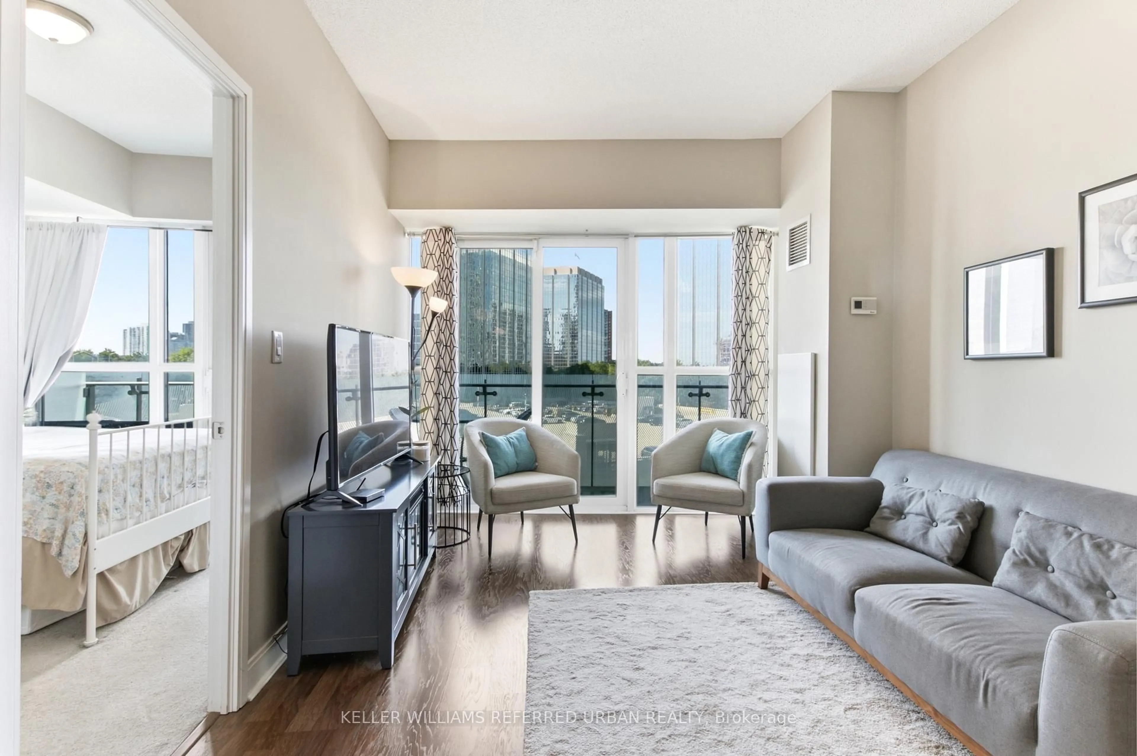 Living room with furniture, unknown for 50 Absolute Ave #401, Mississauga Ontario L4Z 0A8