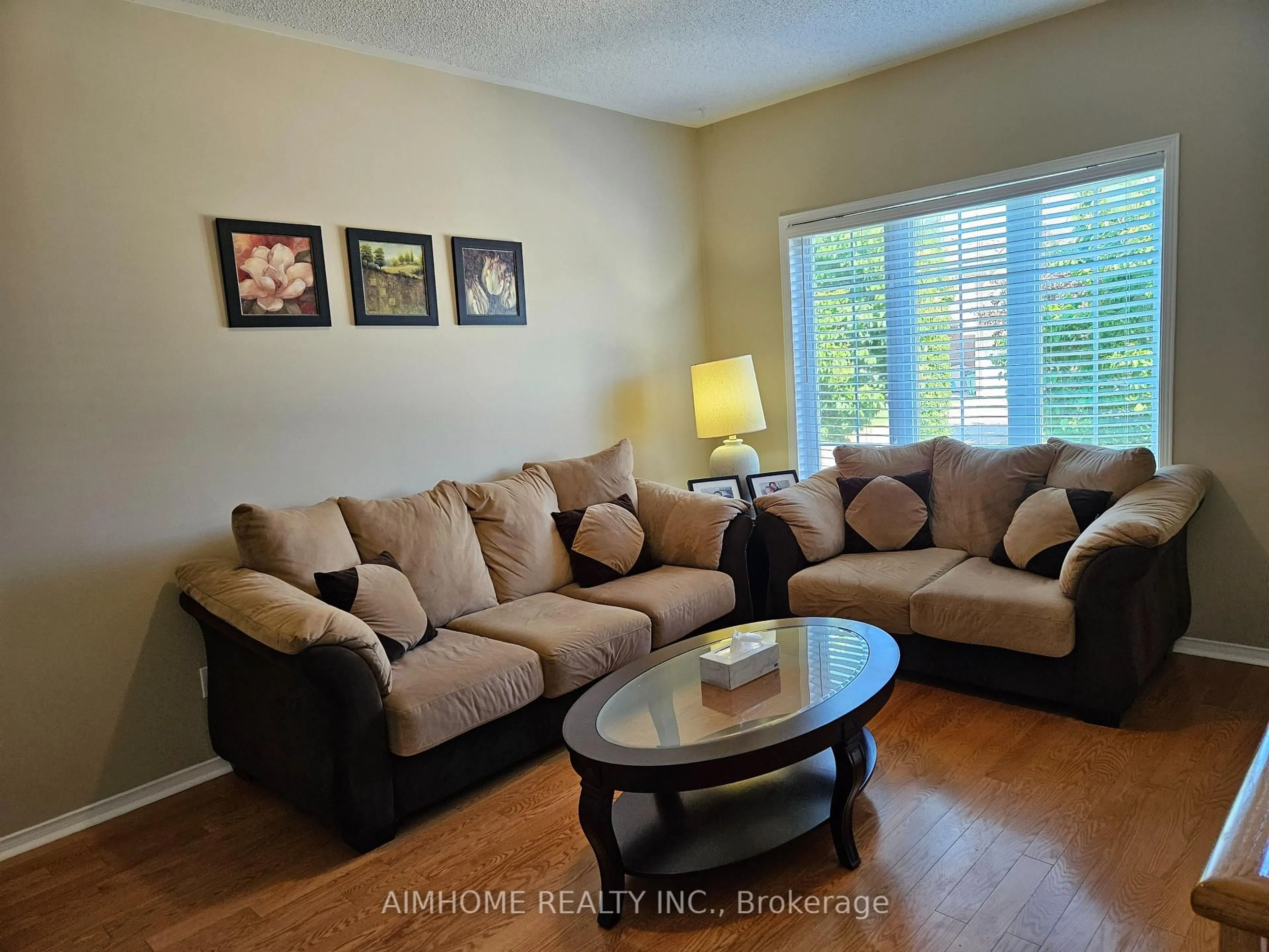 Living room with furniture, wood/laminate floor for 3227 Scotch Pine Gate, Mississauga Ontario L5N 8E6