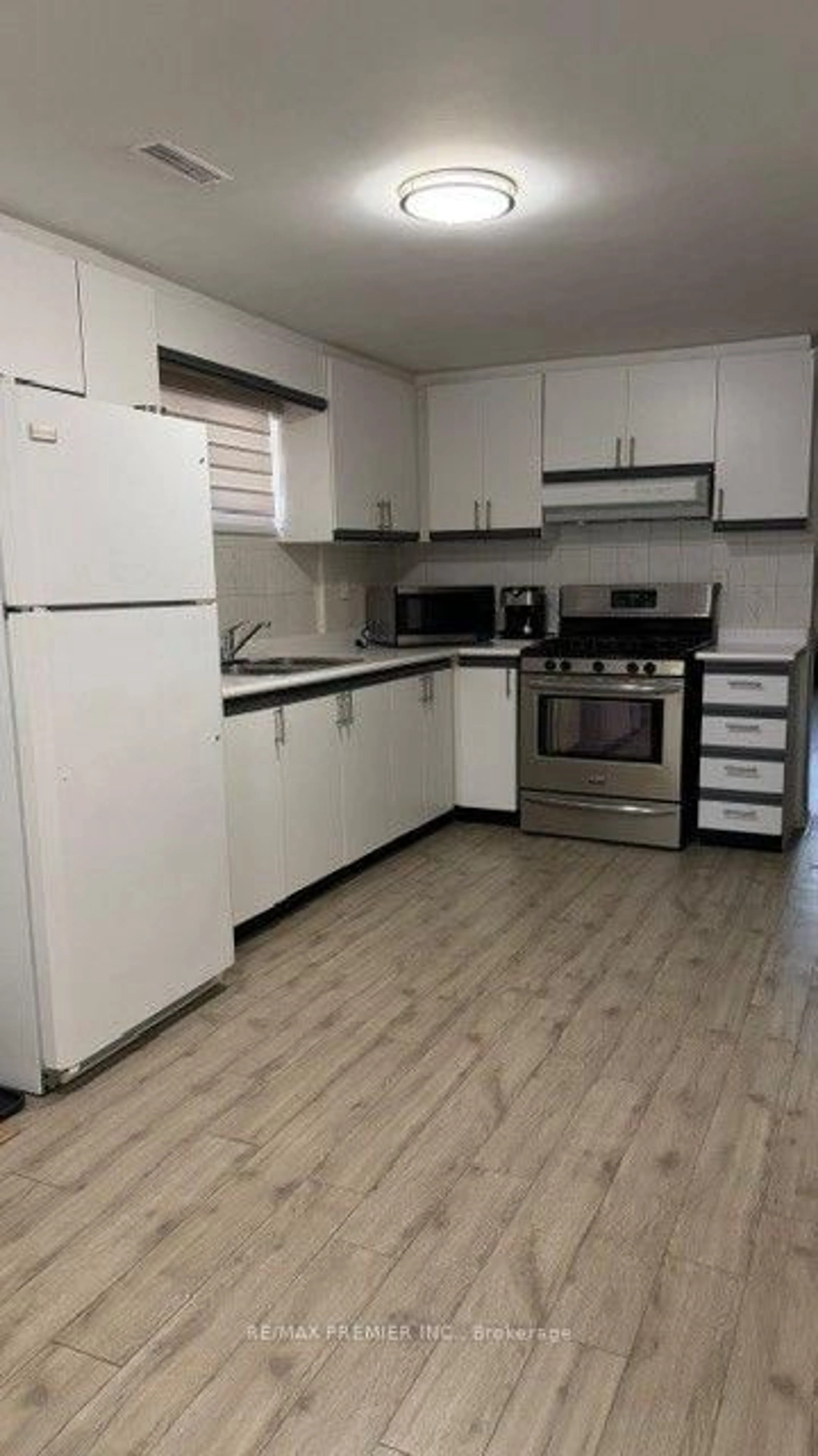 Standard kitchen, wood/laminate floor for 15 Madonna Gdns, Toronto Ontario M9L 2T5
