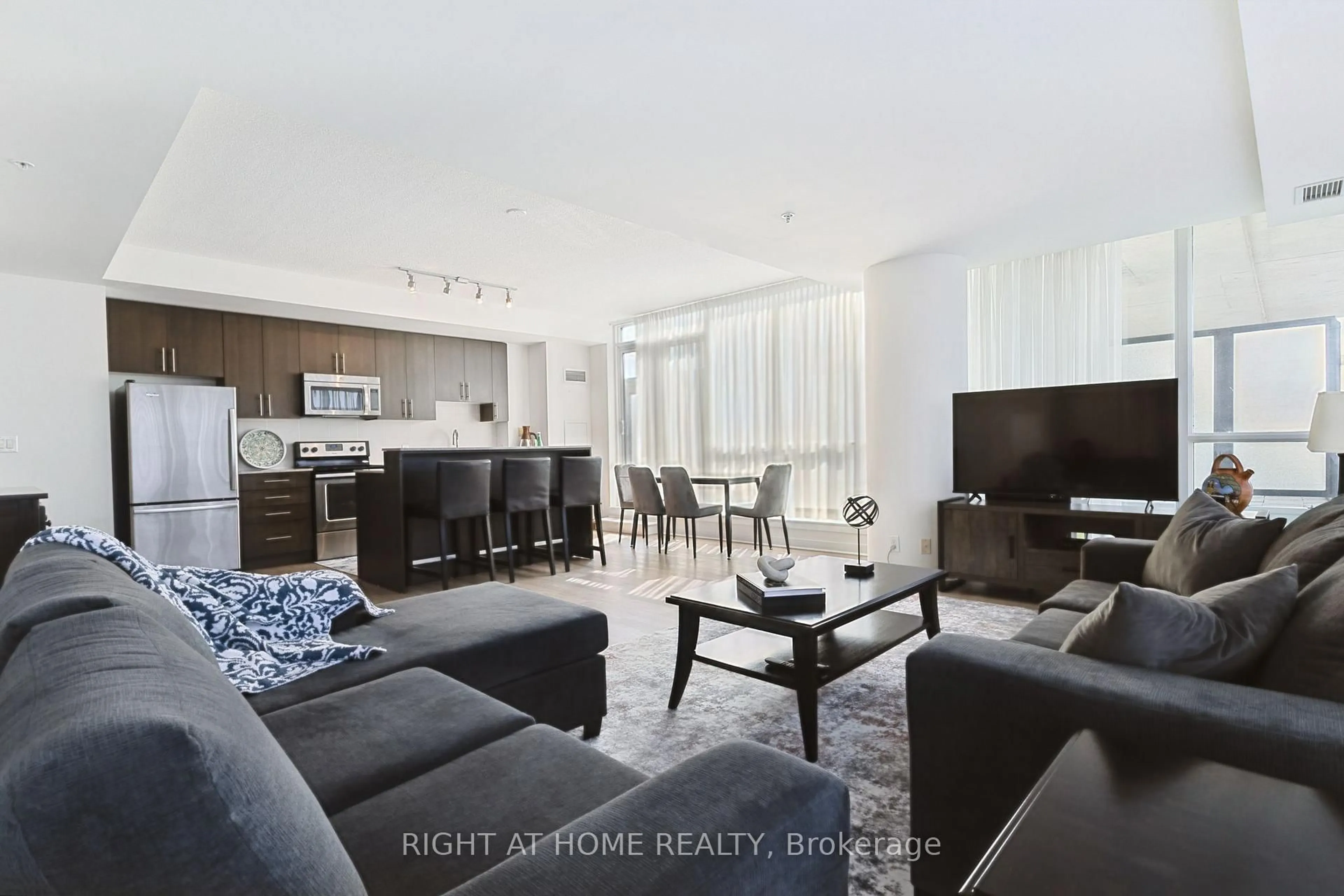 Living room with furniture, unknown for 3985 Grand Park Dr #302, Mississauga Ontario L5B 0H8