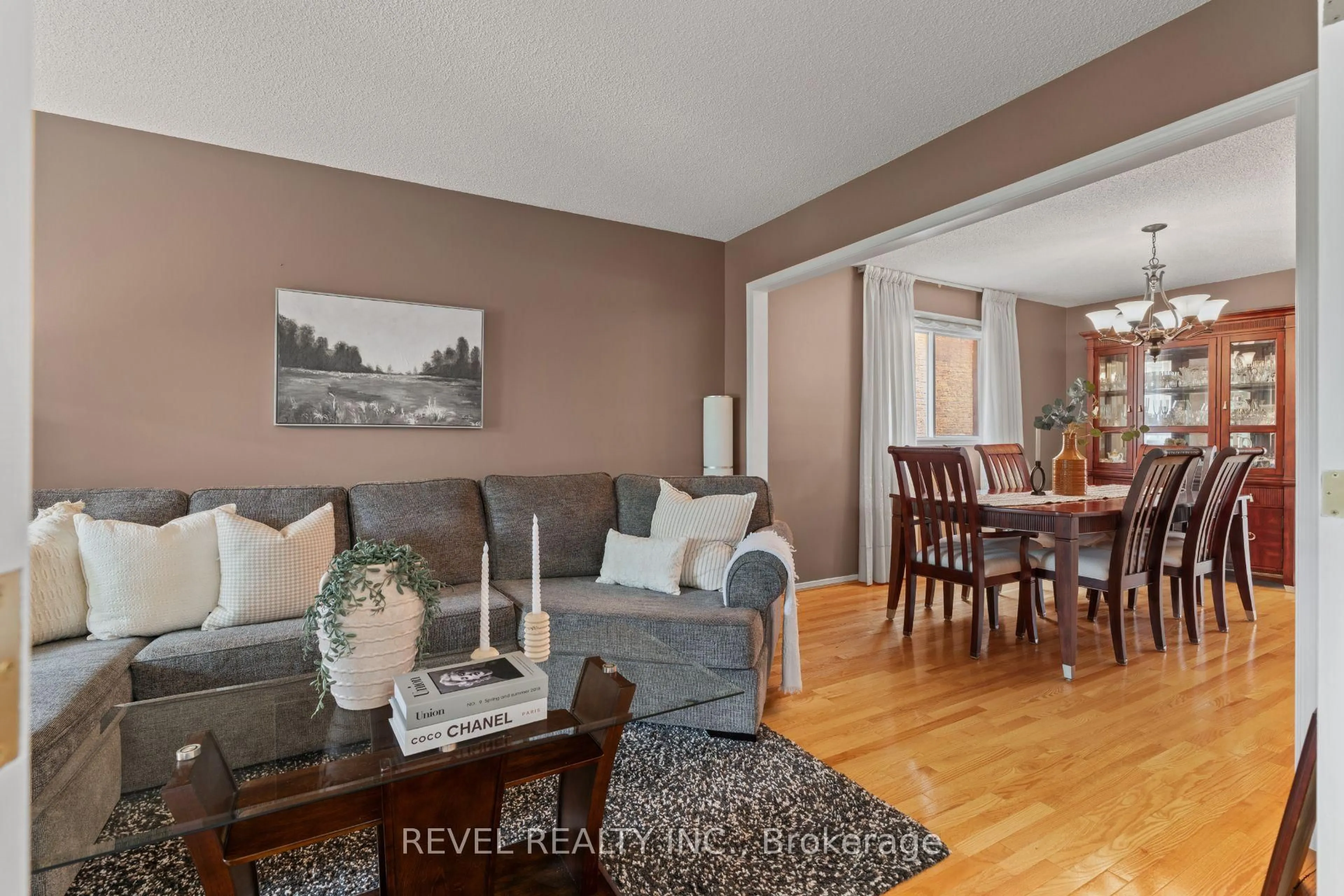 Living room with furniture, wood/laminate floor for 8 Cochrane Ave, Brampton Ontario L6Z 4J4