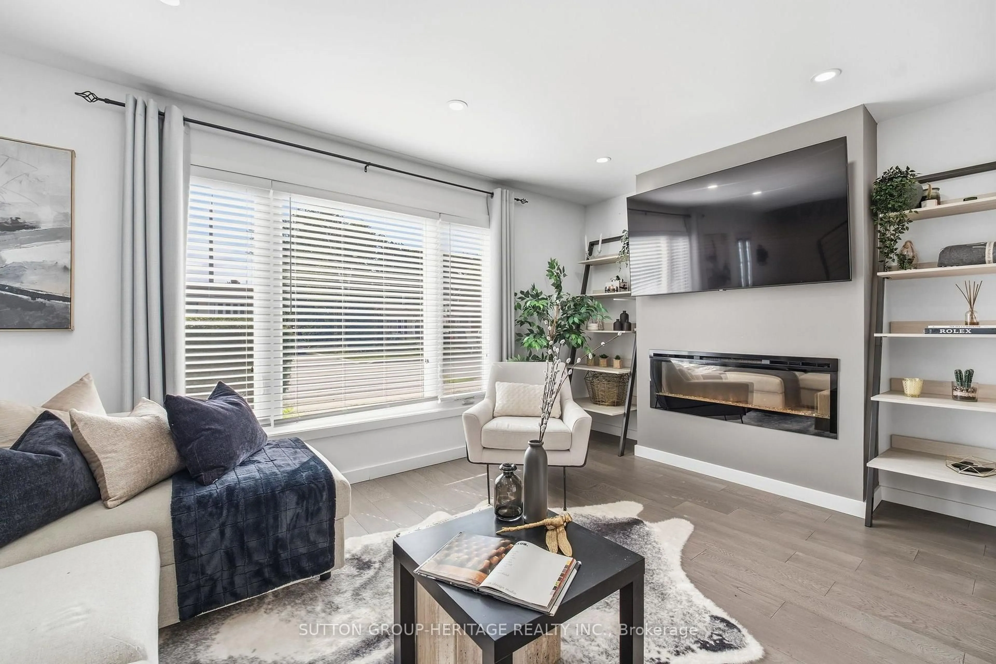 Living room with furniture, wood/laminate floor for 67 Madoc Dr, Brampton Ontario L6V 2A2