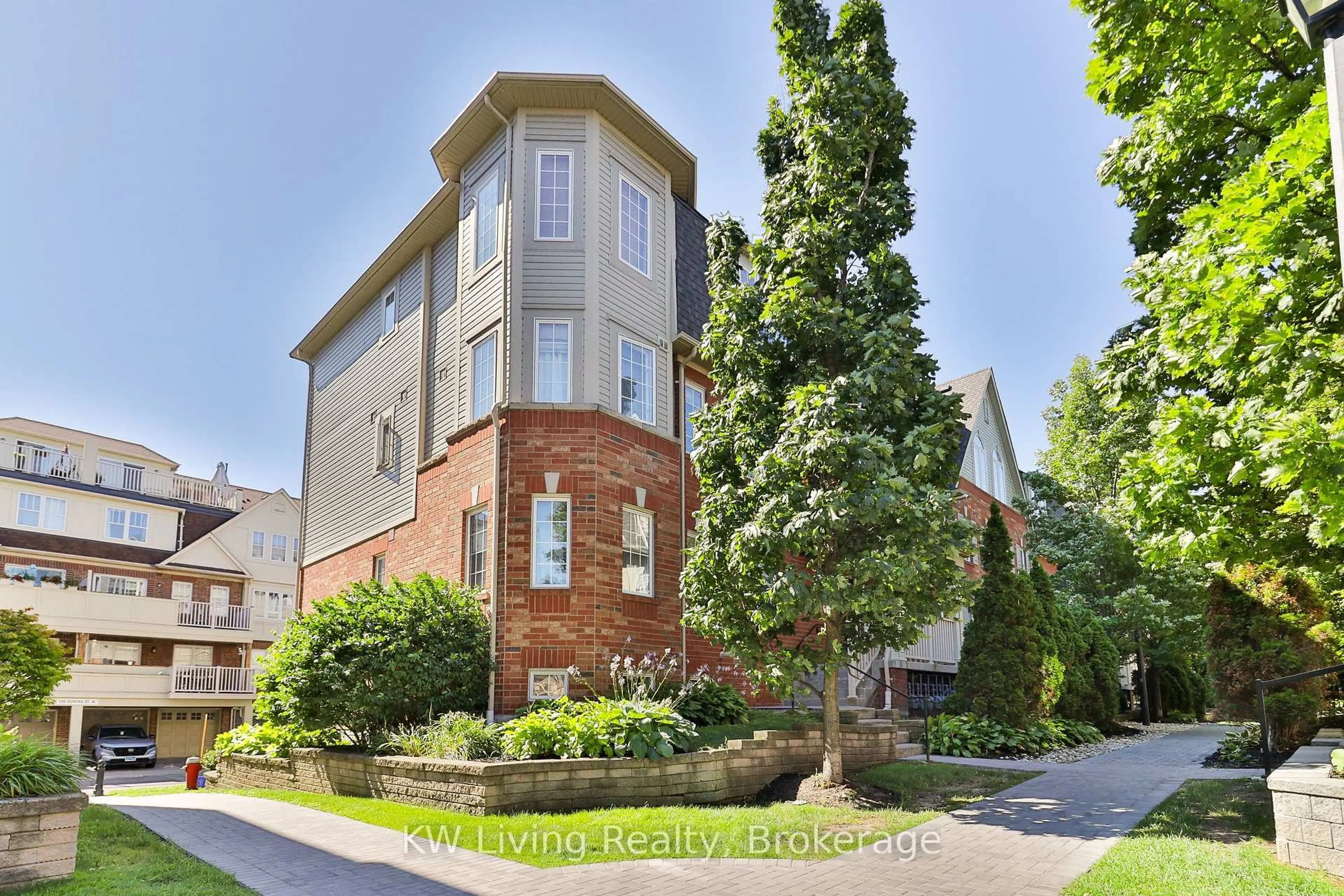 Home with brick exterior material, street for 740 Neighbourhood Circ #4, Mississauga Ontario L5B 0B4