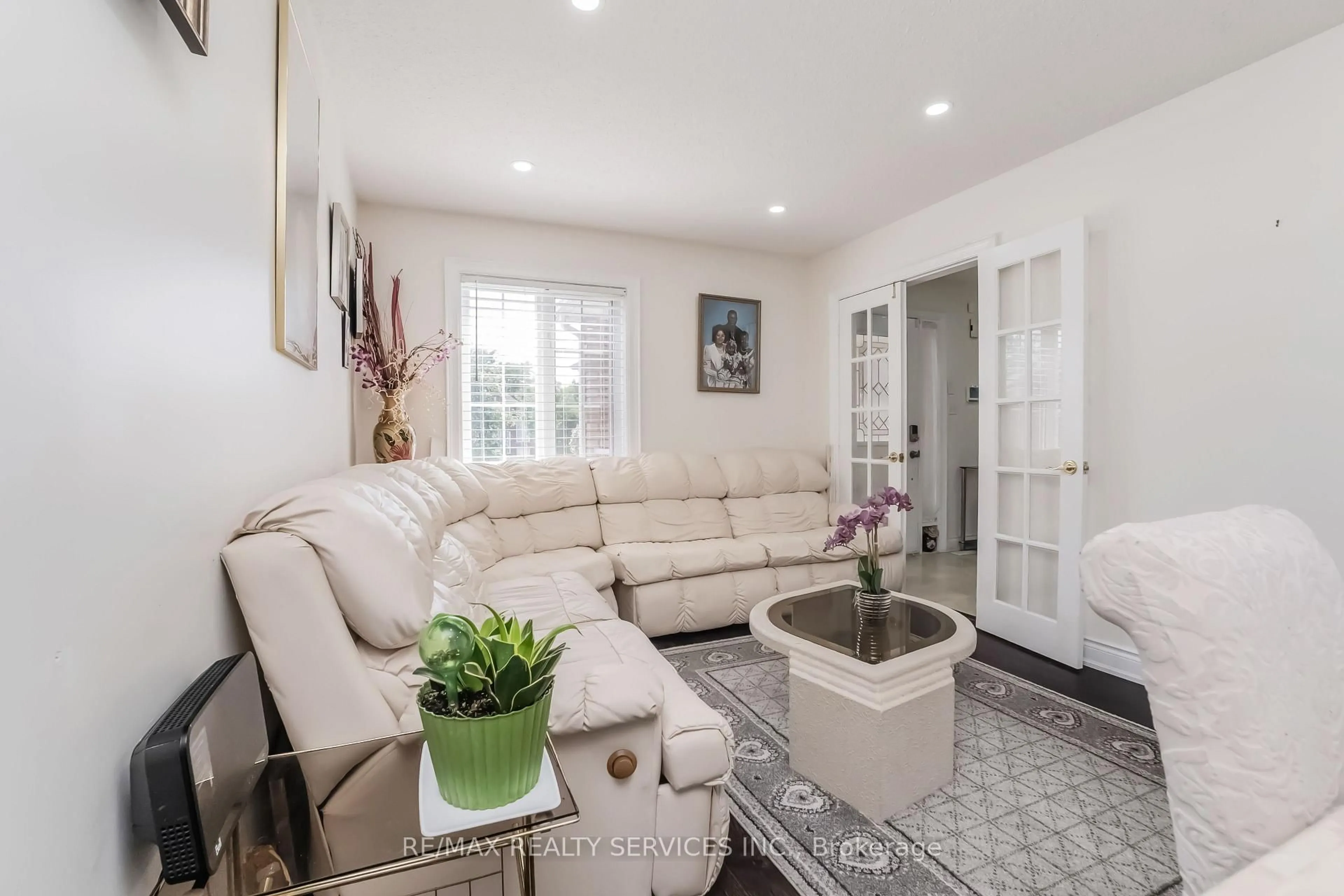Living room with furniture, ceramic/tile floor for 27 Colleyville St, Brampton Ontario L7A 1H7