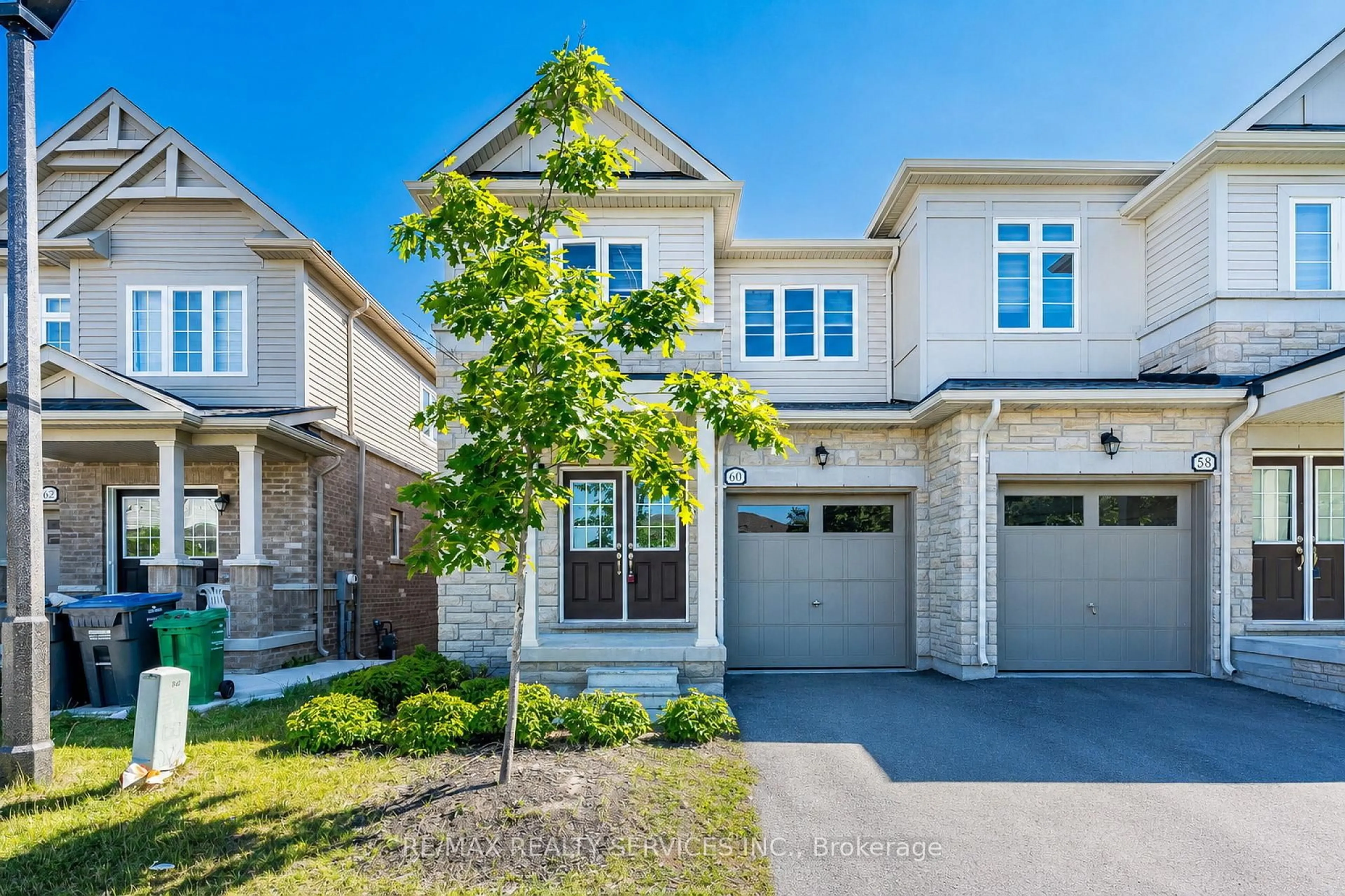 Home with brick exterior material, street for 60 Brixham Lane, Brampton Ontario L7A 5K2