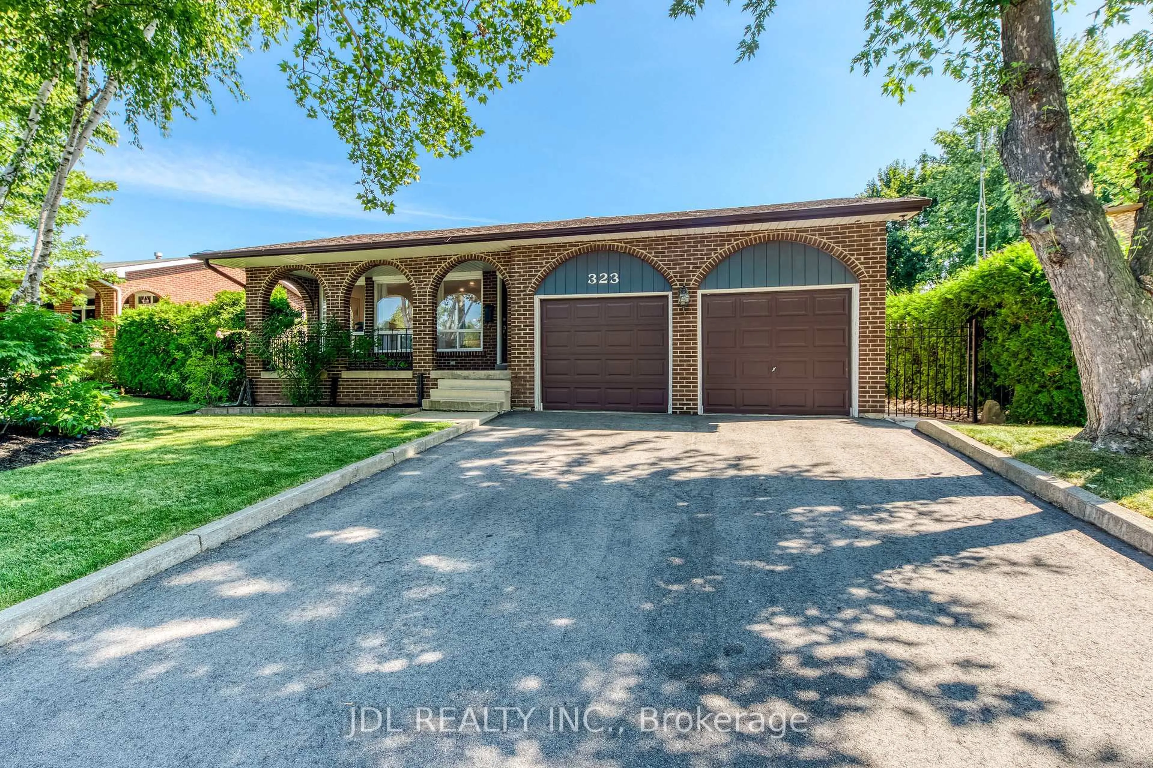Home with brick exterior material, street for 323 Warminster Dr, Oakville Ontario L6L 4N1