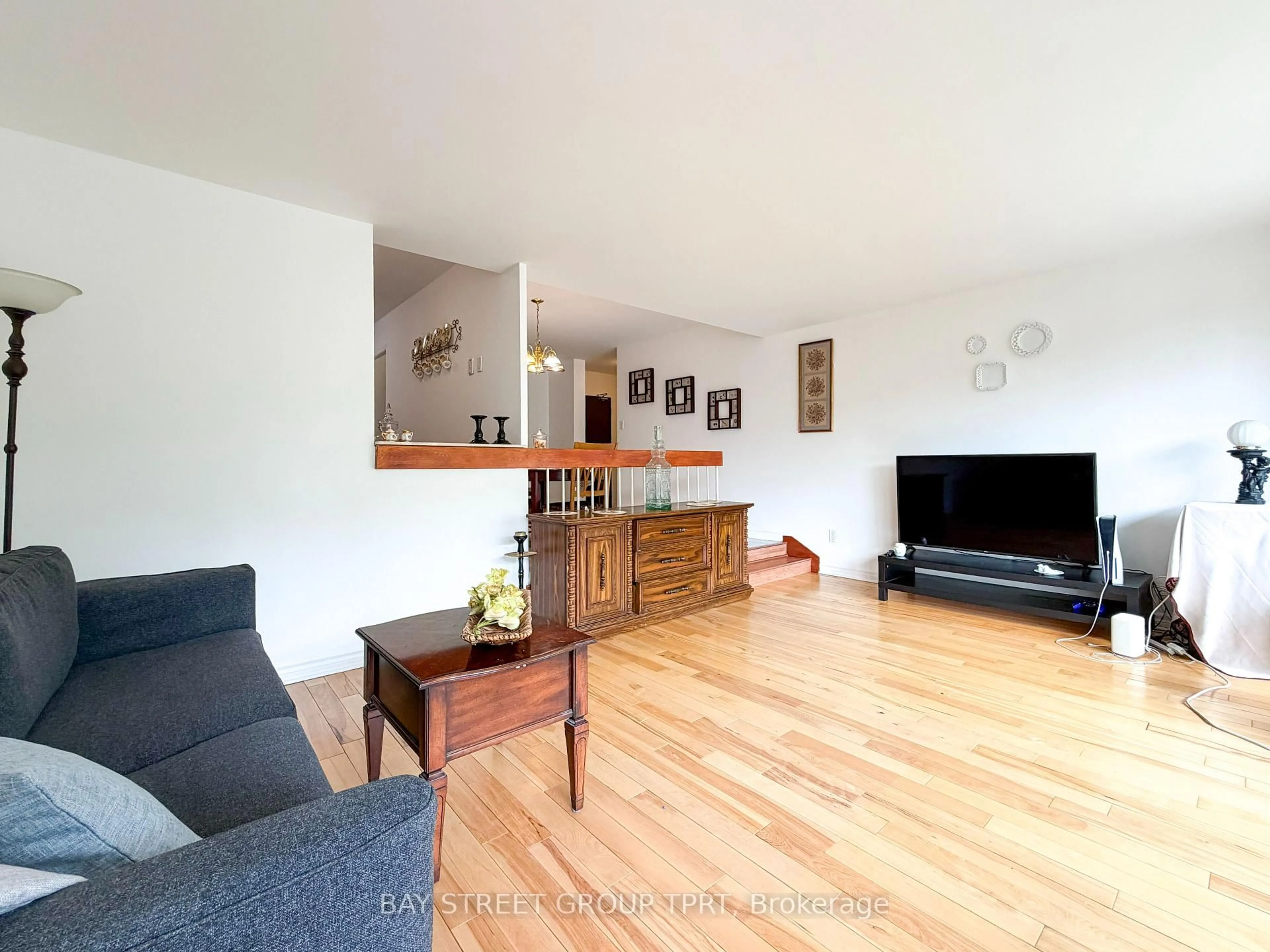 Living room with furniture, wood/laminate floor for 9 Four Winds Dr #208, Toronto Ontario M3J 2S8
