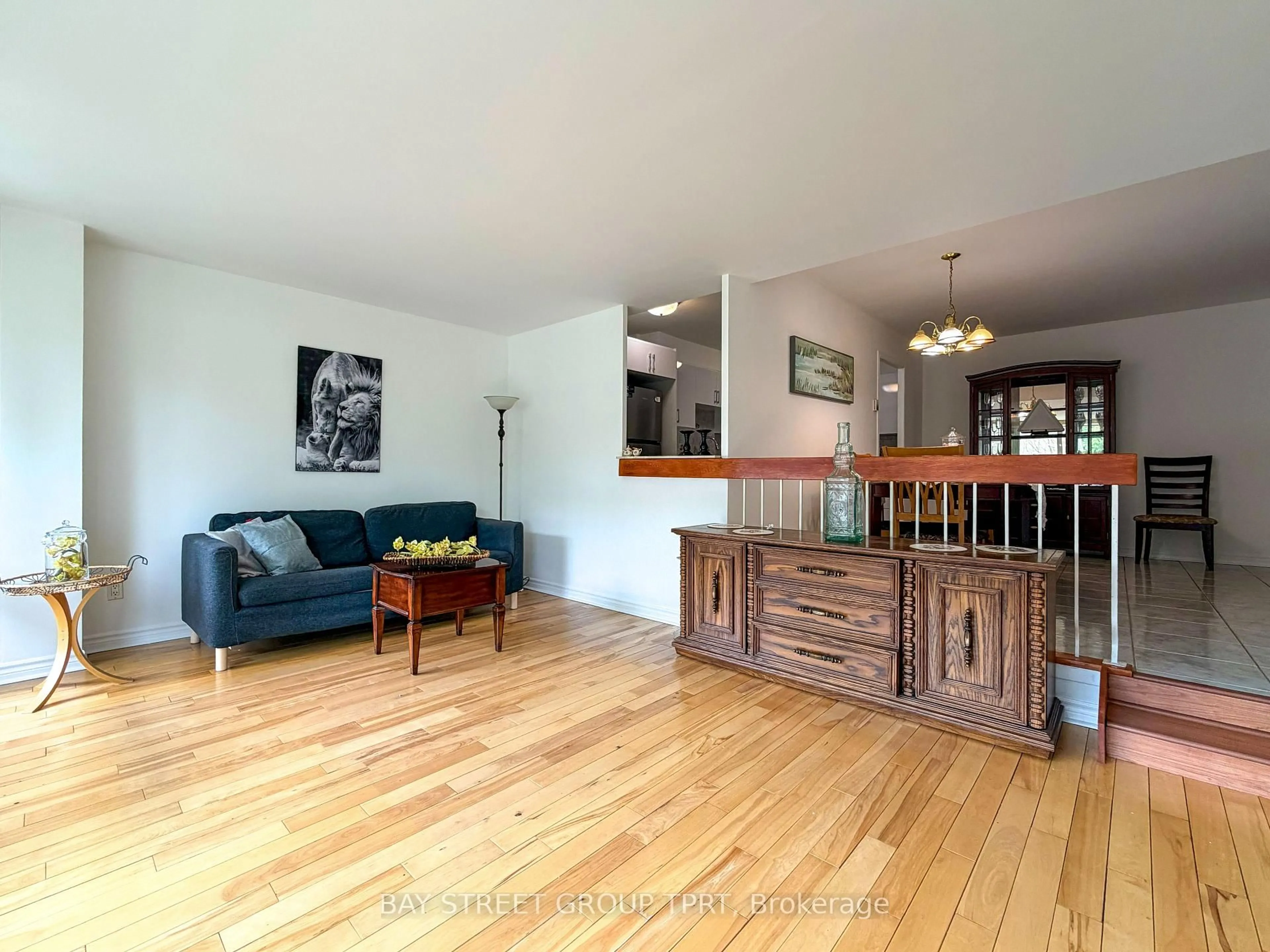 Living room with furniture, wood/laminate floor for 9 Four Winds Dr #208, Toronto Ontario M3J 2S8