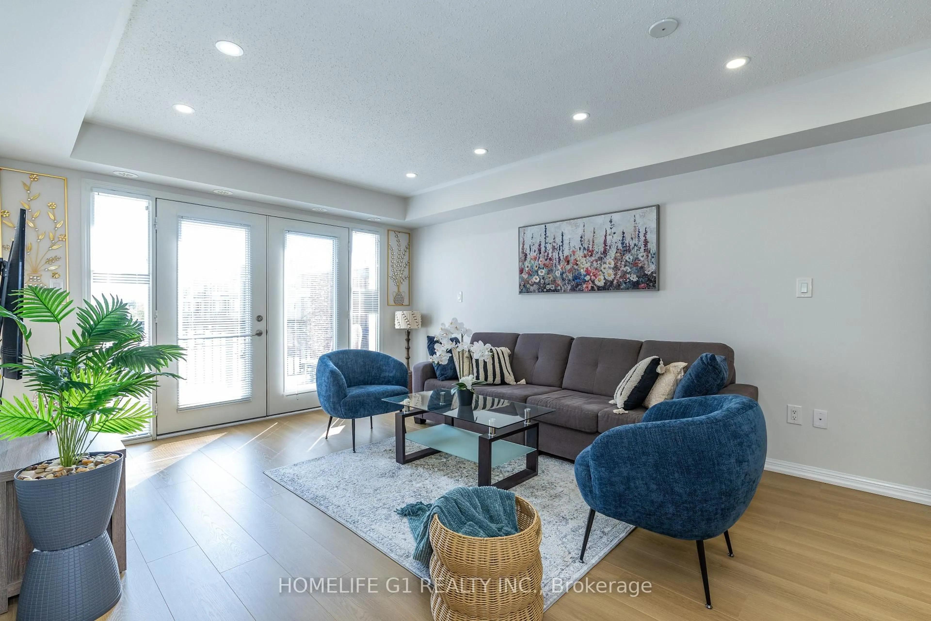 Living room with furniture, wood/laminate floor for 250 Sunny Meadow Blvd #45, Brampton Ontario L6R 3Y7