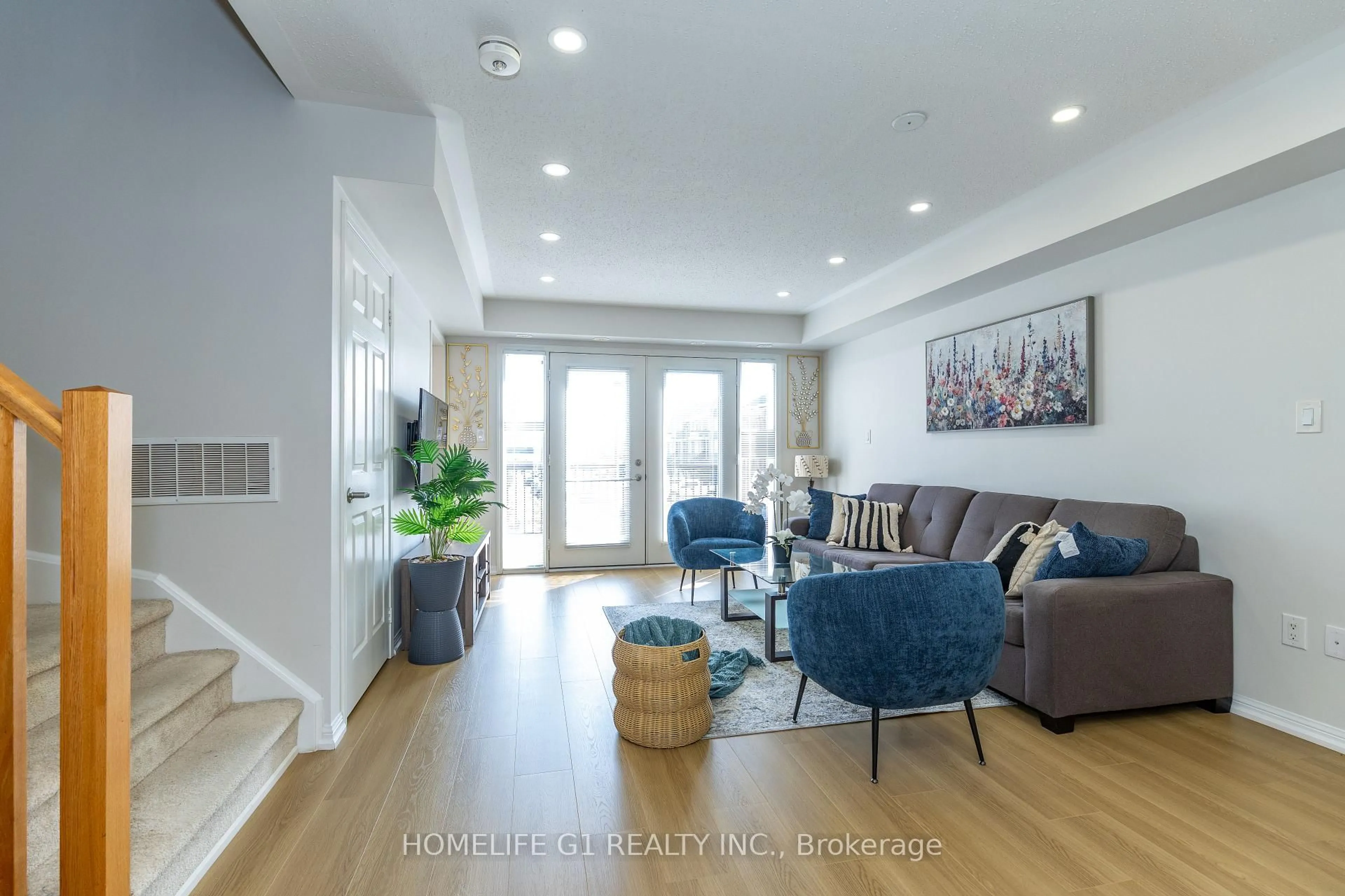 Living room with furniture, wood/laminate floor for 250 Sunny Meadow Blvd #45, Brampton Ontario L6R 3Y7