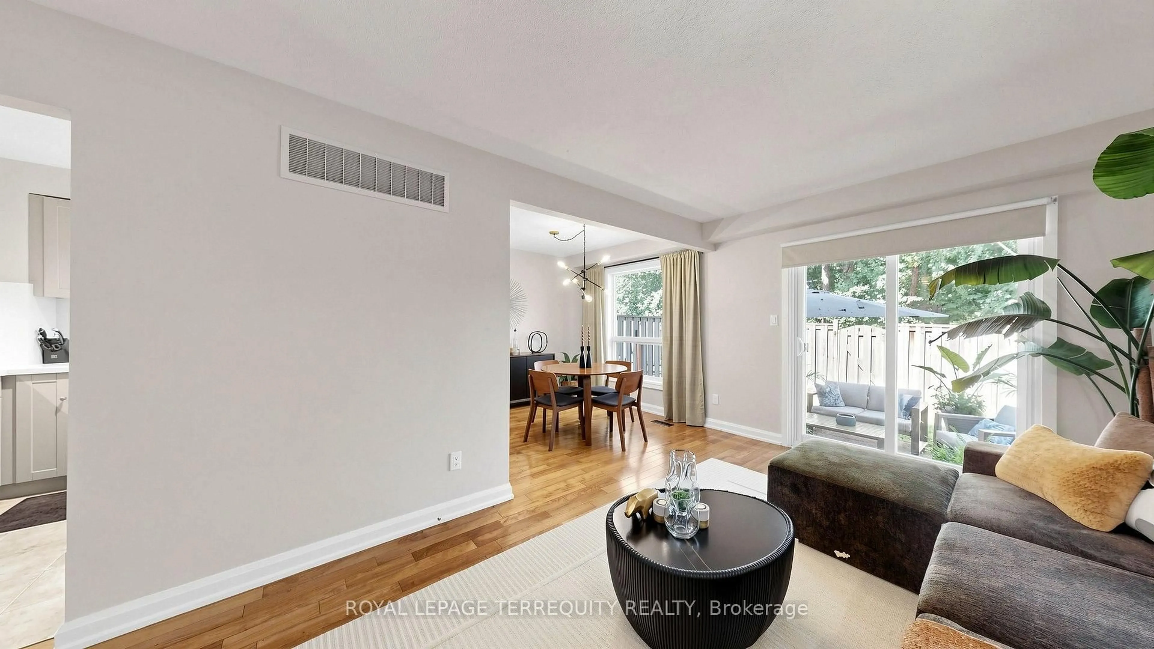 Living room with furniture, wood/laminate floor for 18 Morley Cres #18, Brampton Ontario L6S 3K8