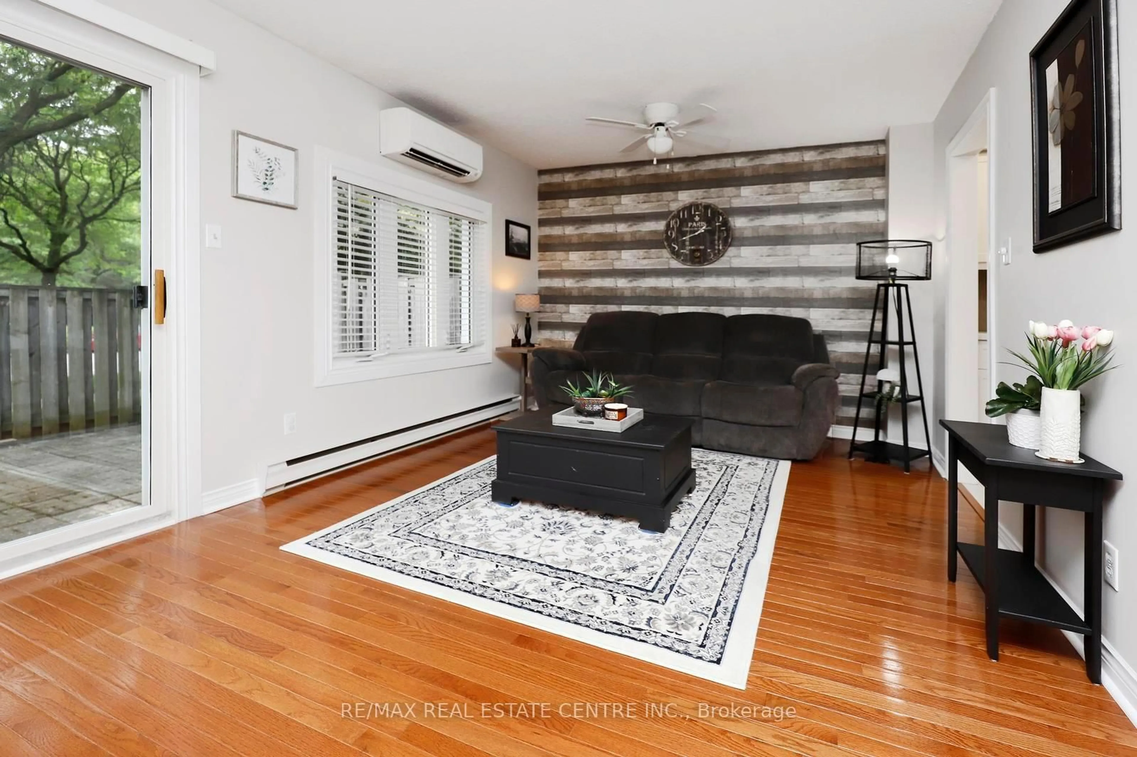 Living room with furniture, wood/laminate floor for 341 Wilson Dr #3, Milton Ontario L9T 3Y9
