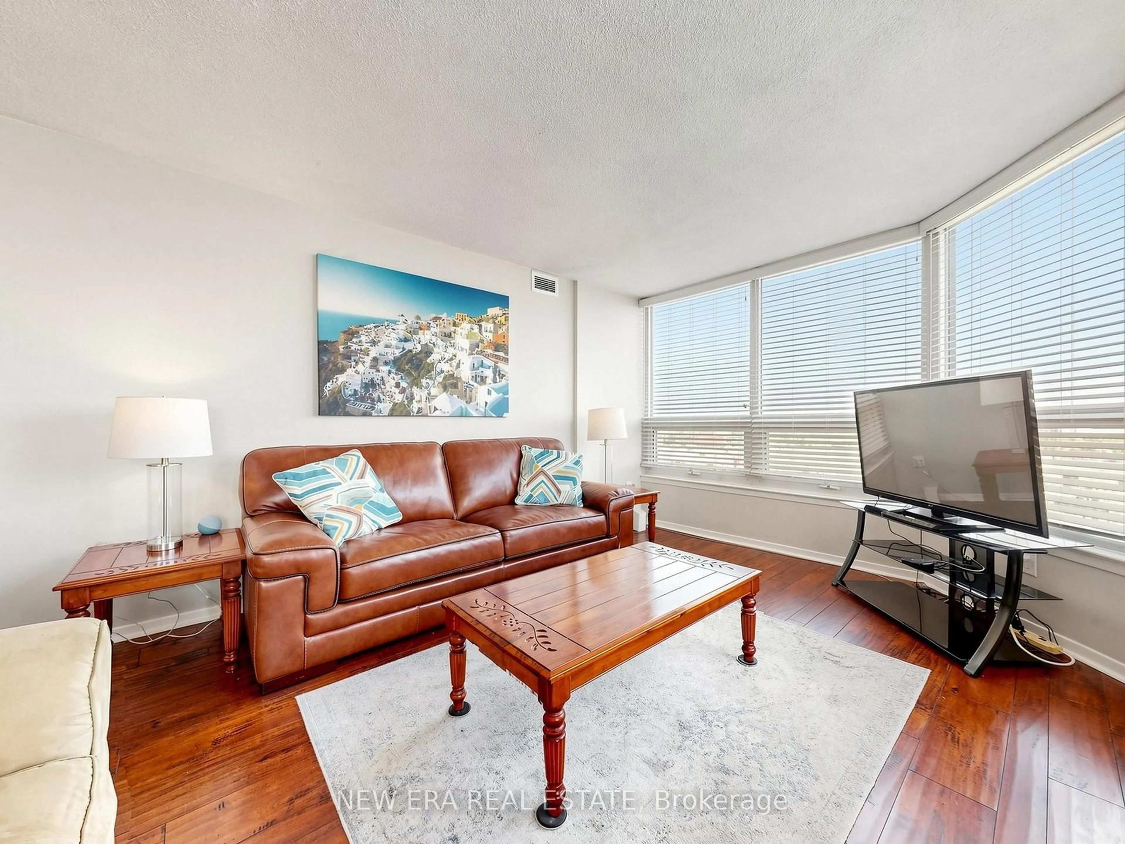Living room with furniture, wood/laminate floor for 8 Lisa St #2108, Brampton Ontario L6T 4S6