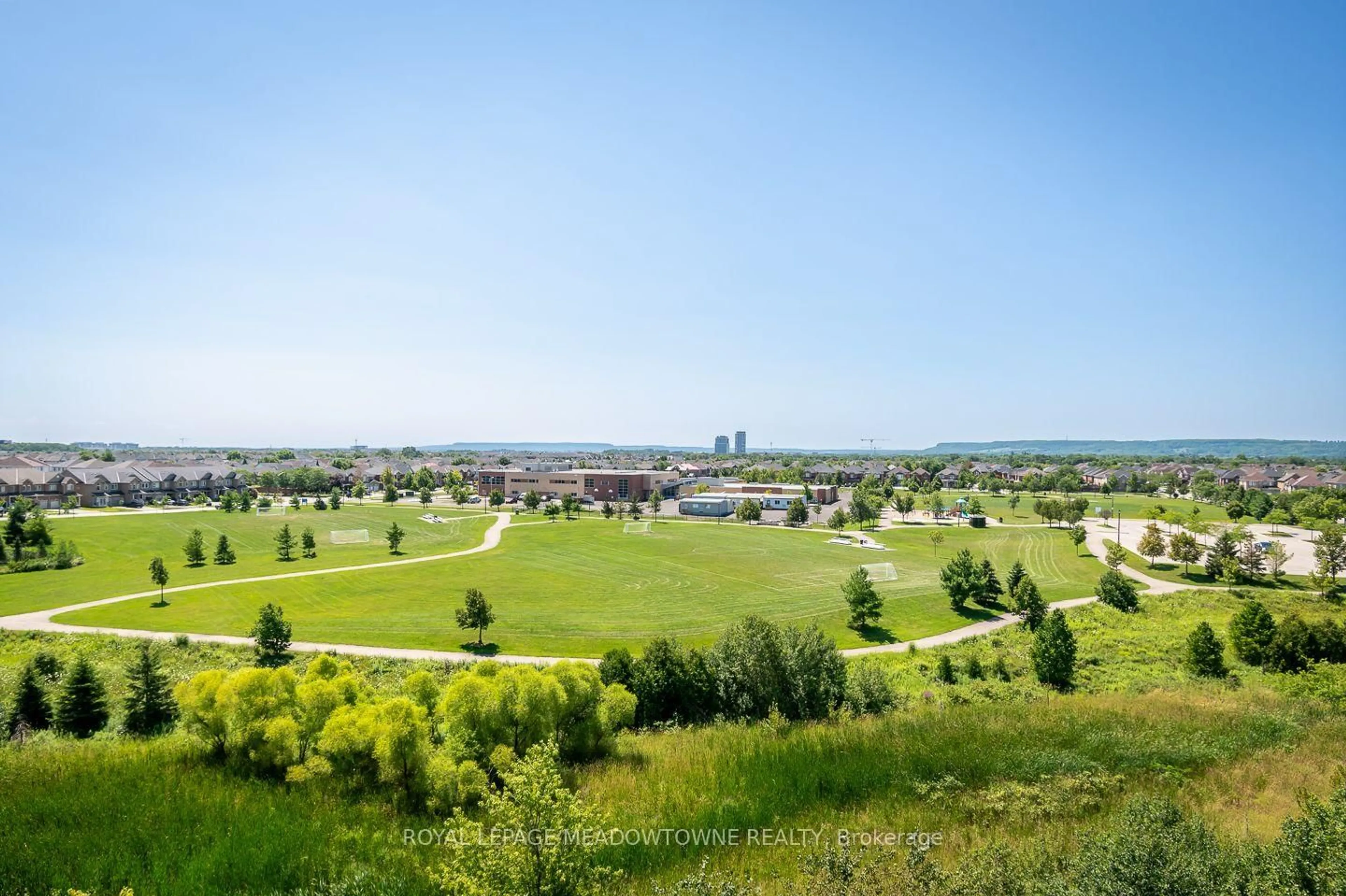 A pic from outside/outdoor area/front of a property/back of a property/a pic from drone, mountain view for 1419 Costigan Rd #607, Milton Ontario L9T 2L4
