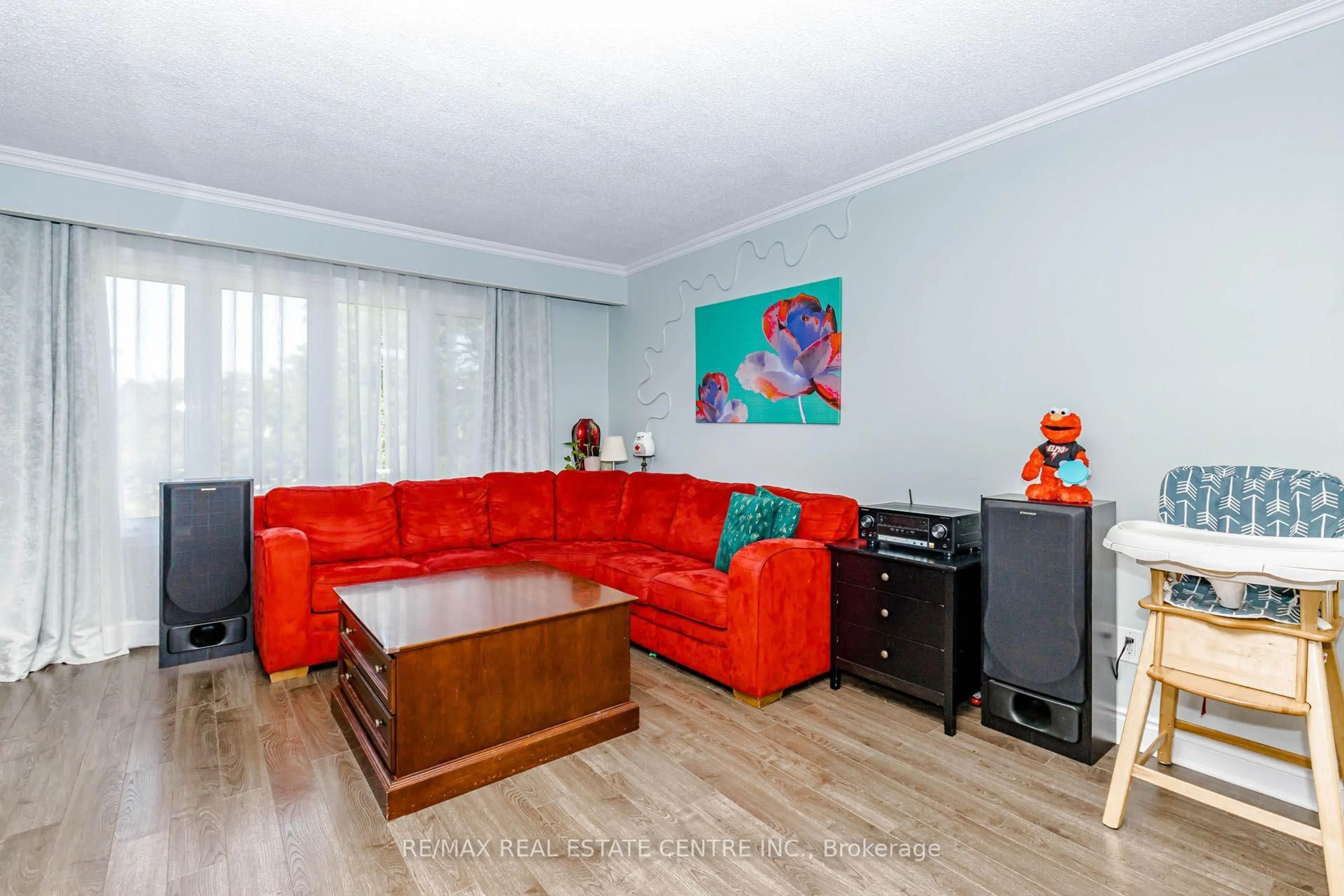 Living room with furniture, wood/laminate floor for 28 Foxacre Row, Brampton Ontario L6V 3P5