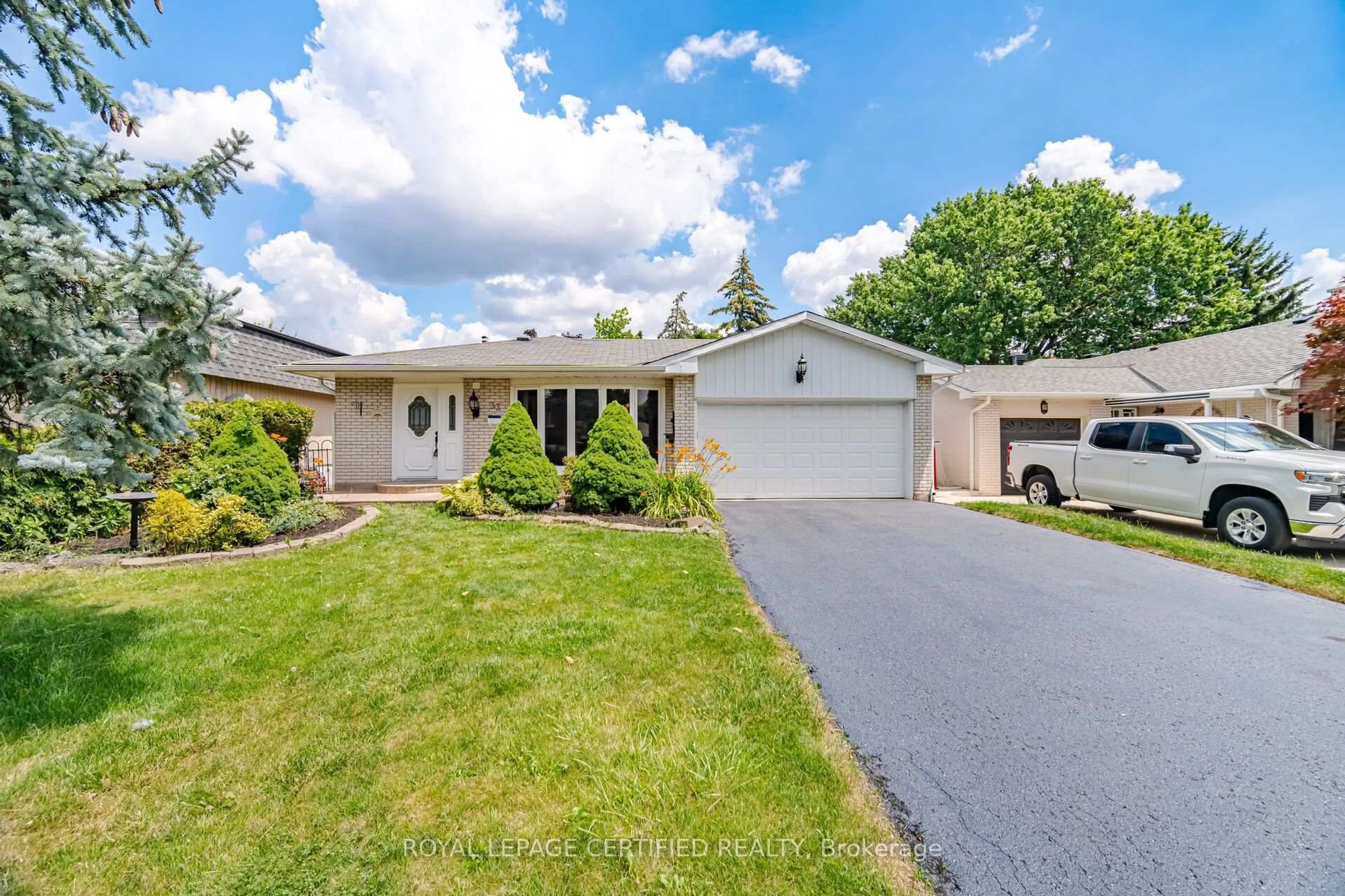 Home with vinyl exterior material, street for 33 Grassmere Cres, Brampton Ontario L6S 1C9