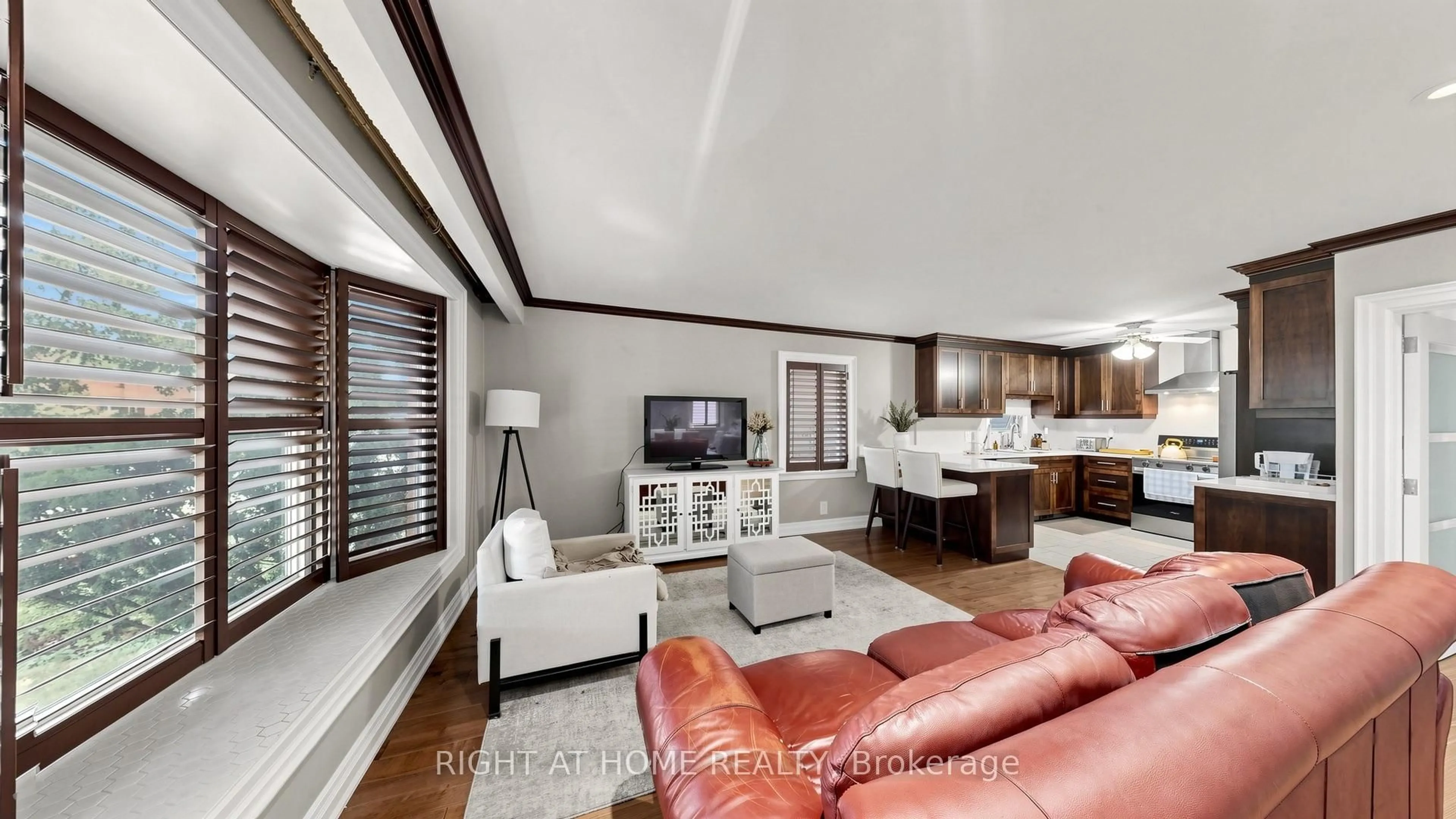 Living room with furniture, wood/laminate floor for 87 Riverdale Dr, Toronto Ontario M9V 2T8