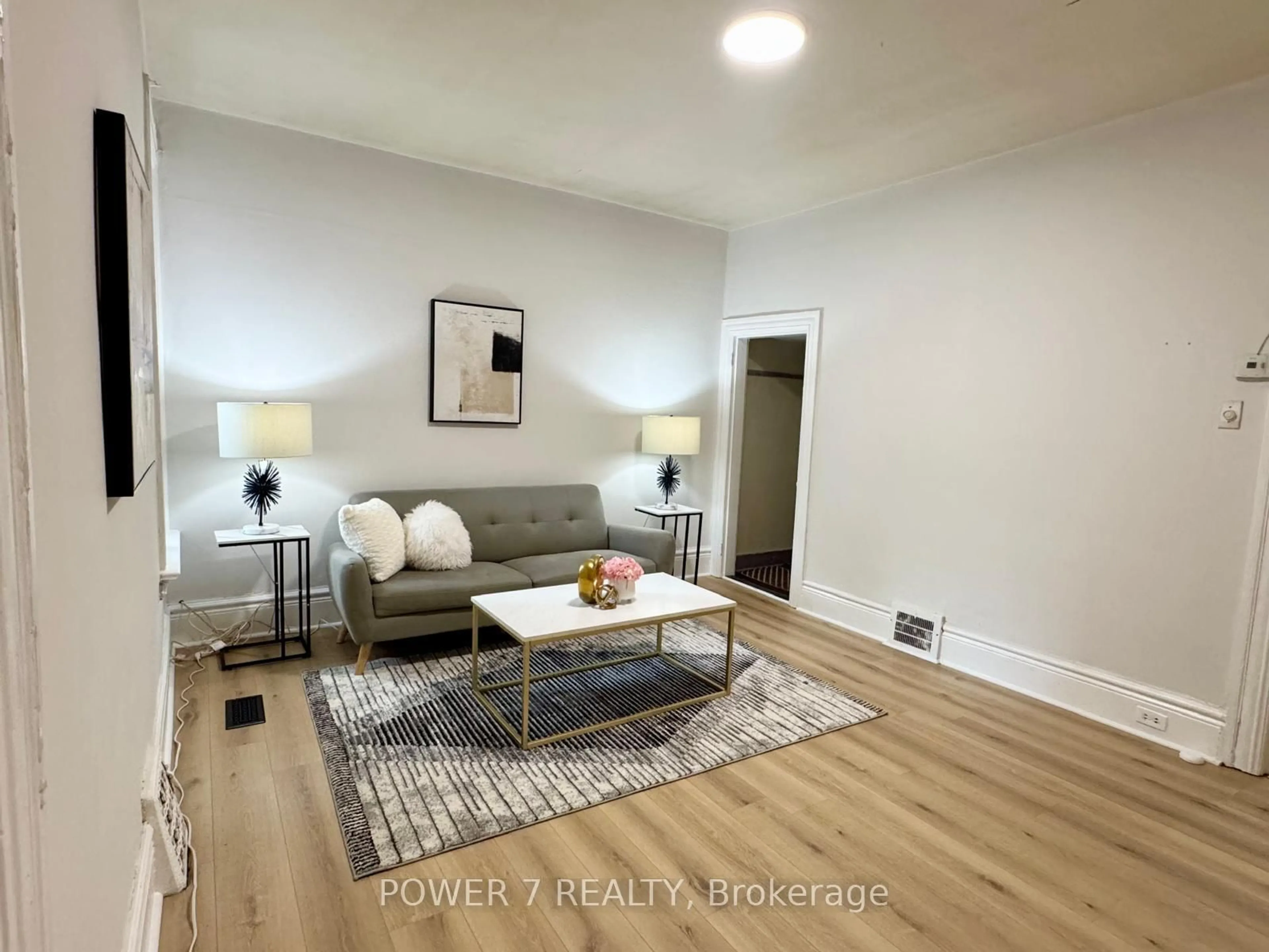 Living room with furniture, wood/laminate floor for 810 Ossington Ave, Toronto Ontario M6G 3V1