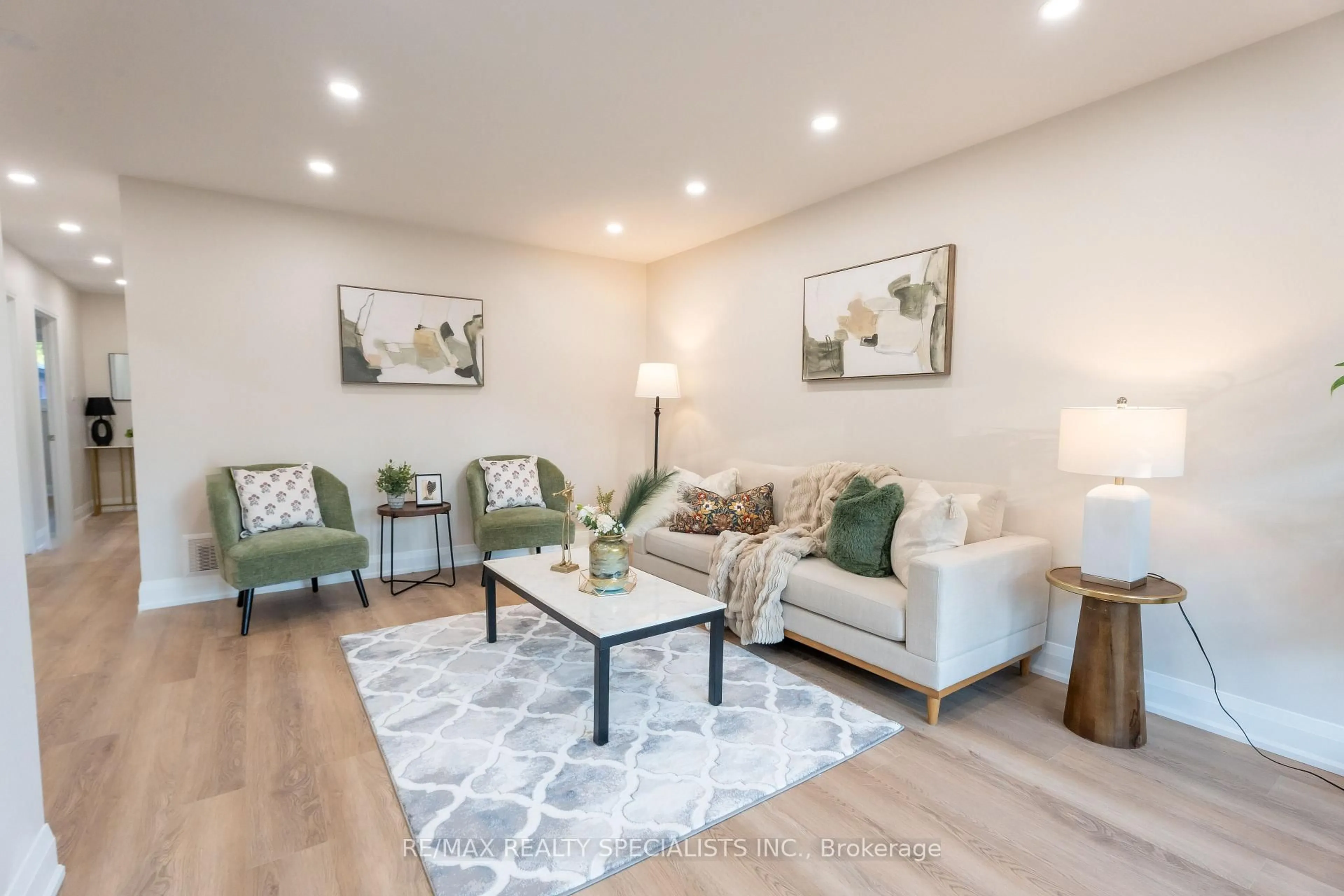 Living room with furniture, wood/laminate floor for 159 Bartley Bull Pkwy, Brampton Ontario L6W 2K1