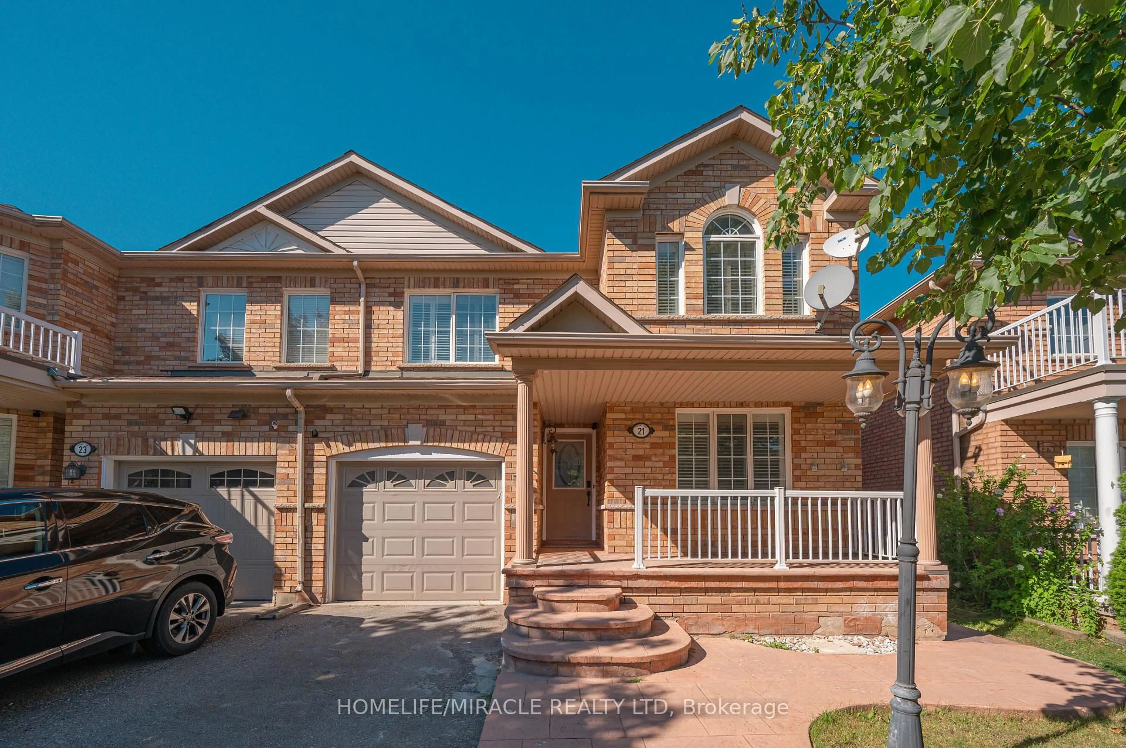 Home with brick exterior material, street for 21 Topiary Lane, Brampton Ontario L7A 2K6