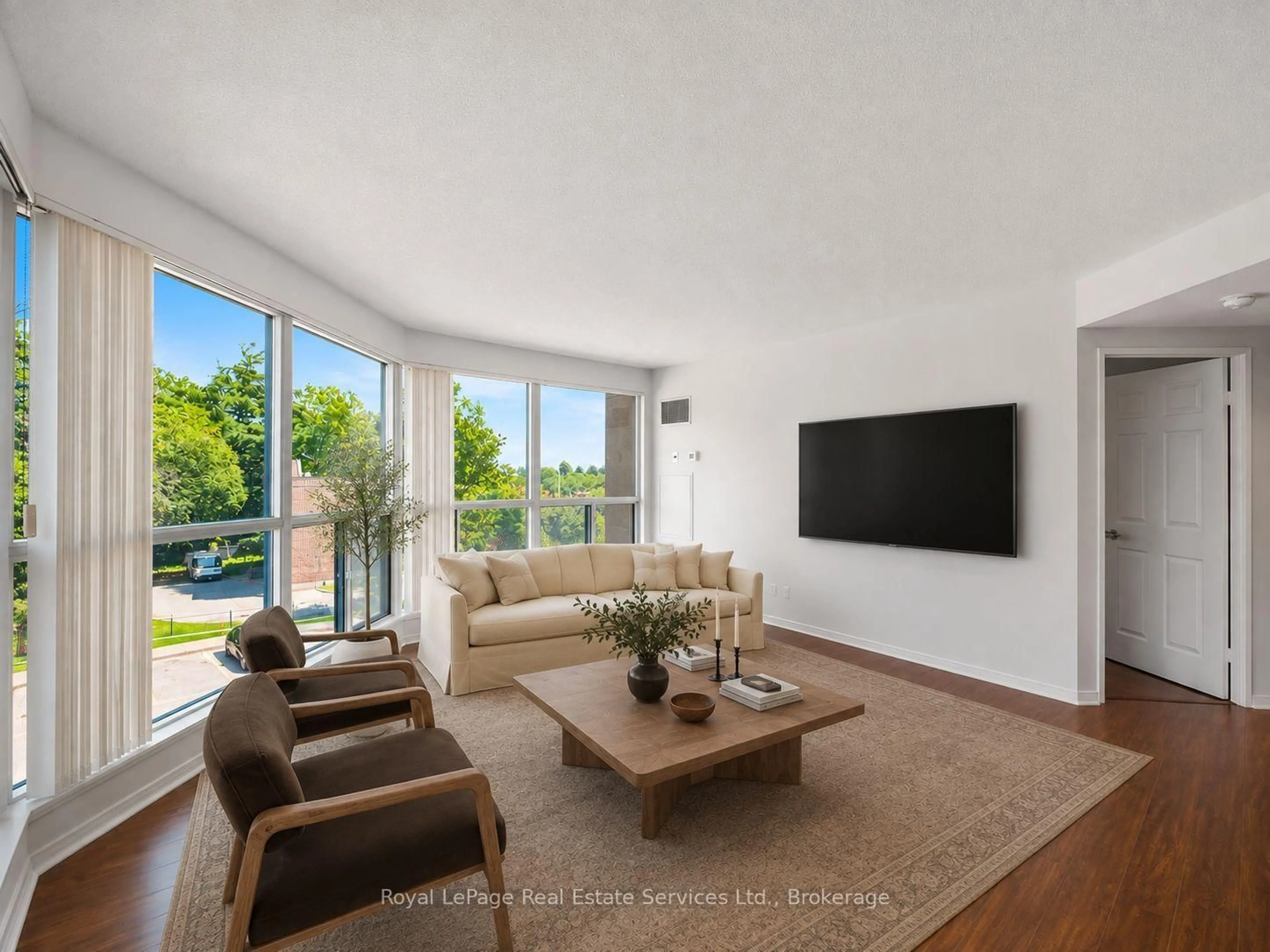 Living room with furniture, unknown for 2177 Burnhamthorpe Rd #309, Mississauga Ontario L5L 5P9