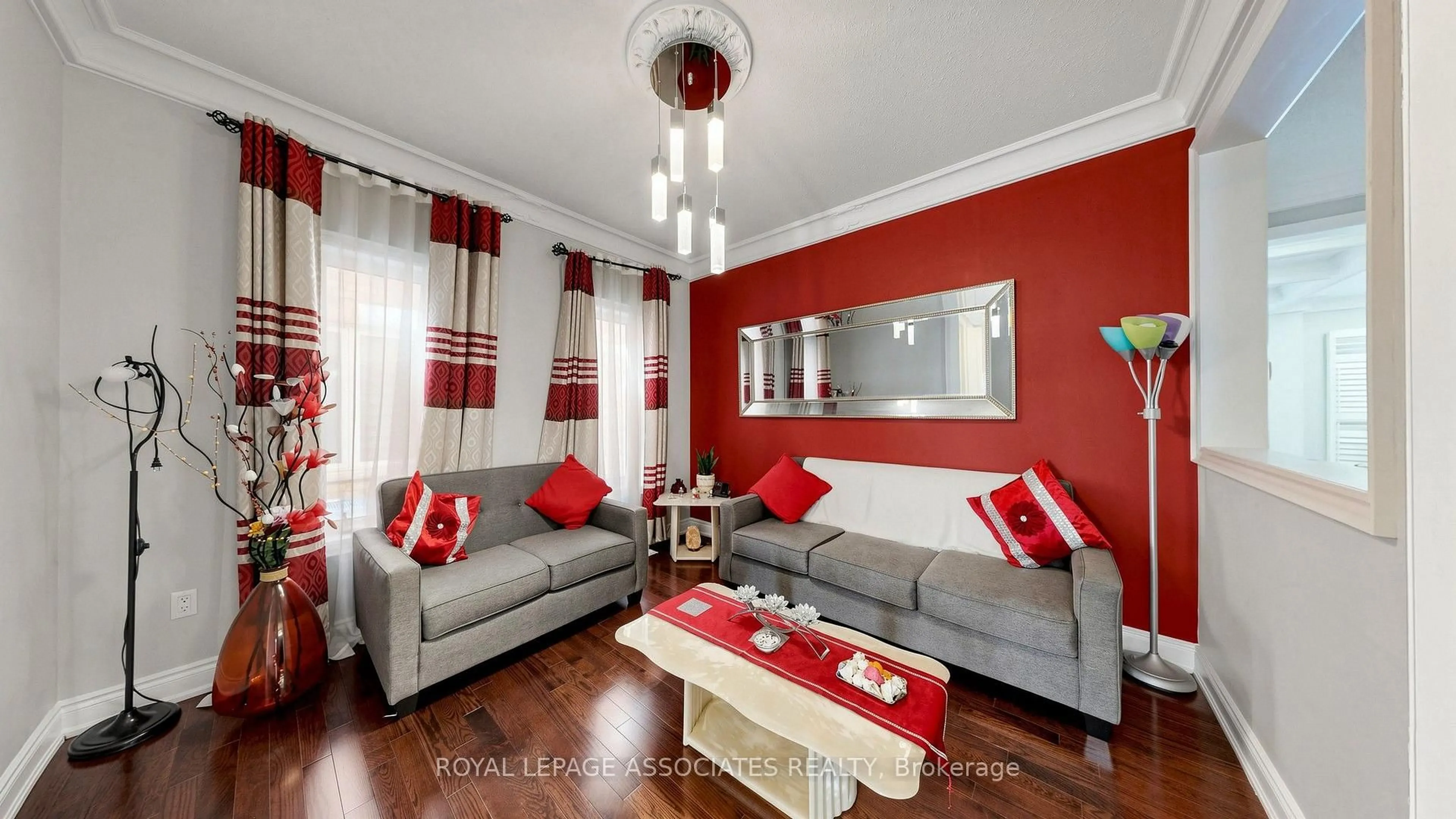 Living room with furniture, wood/laminate floor for 35 Godliman Rd, Brampton Ontario L6X 5G3