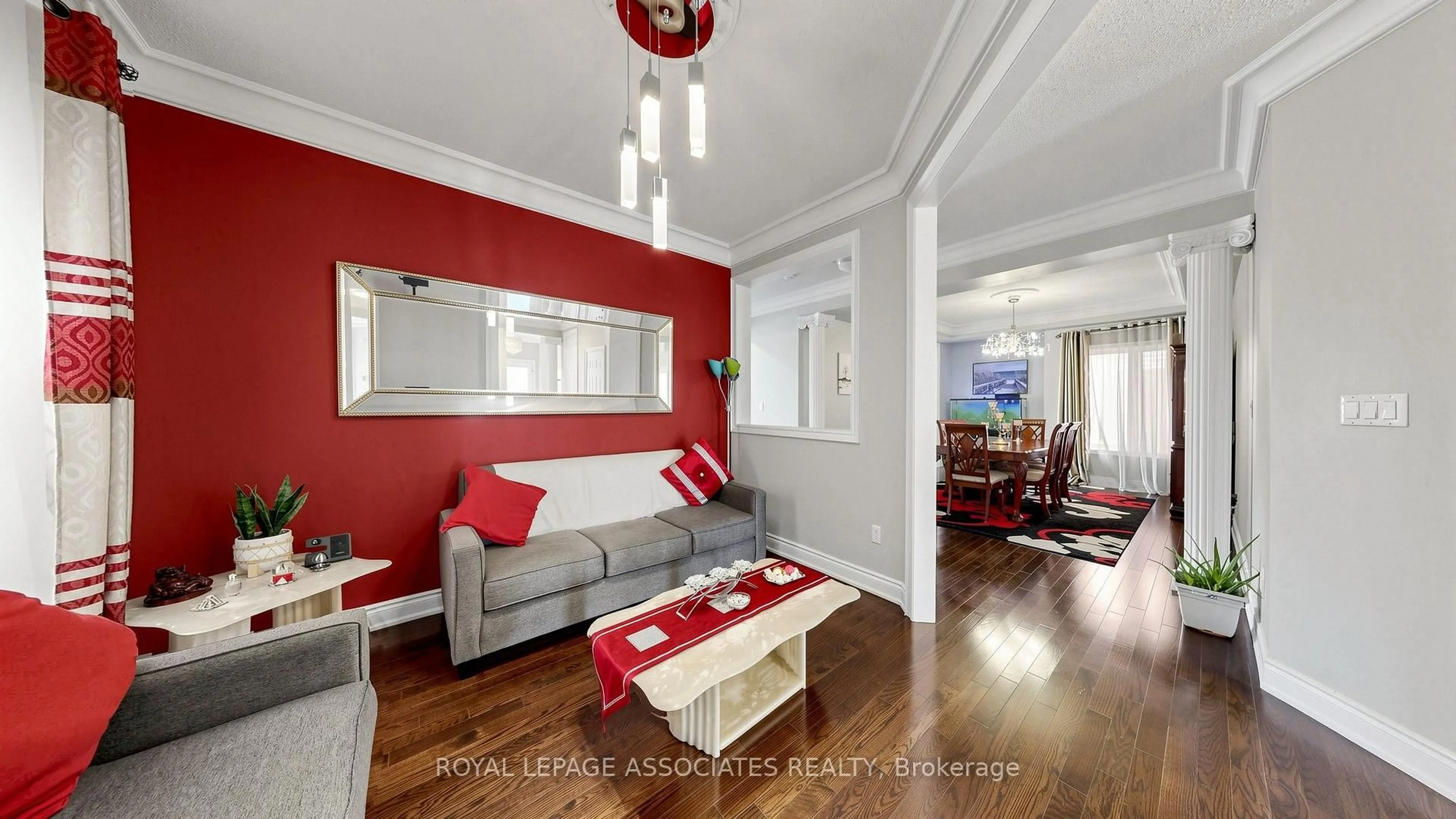 Living room with furniture, wood/laminate floor for 35 Godliman Rd, Brampton Ontario L6X 5G3