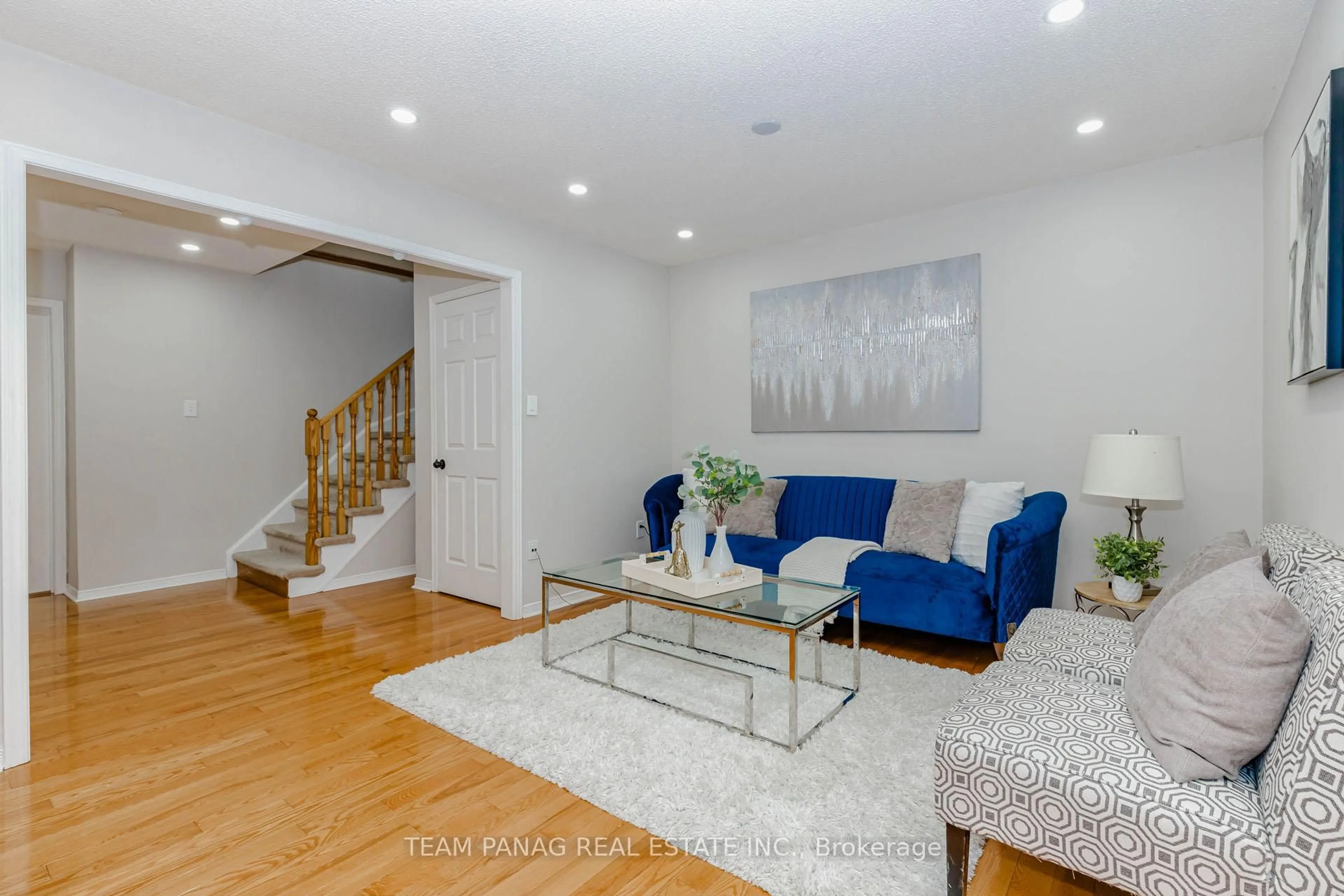 Living room with furniture, wood/laminate floor for 25 Ural Circ, Brampton Ontario L6R 1H3