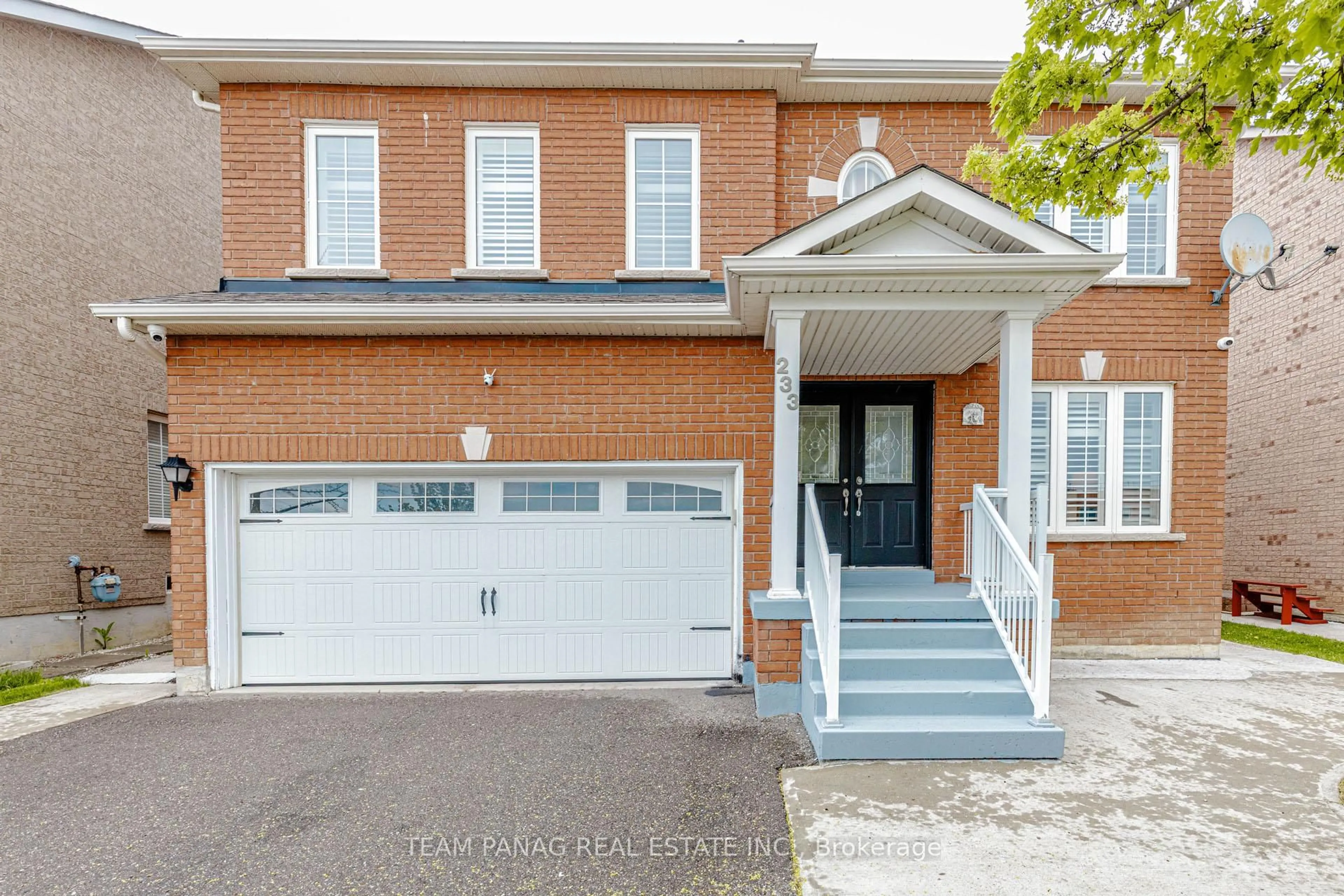 Home with brick exterior material, street for 233 Queen Mary Dr, Brampton Ontario L7A 3L3